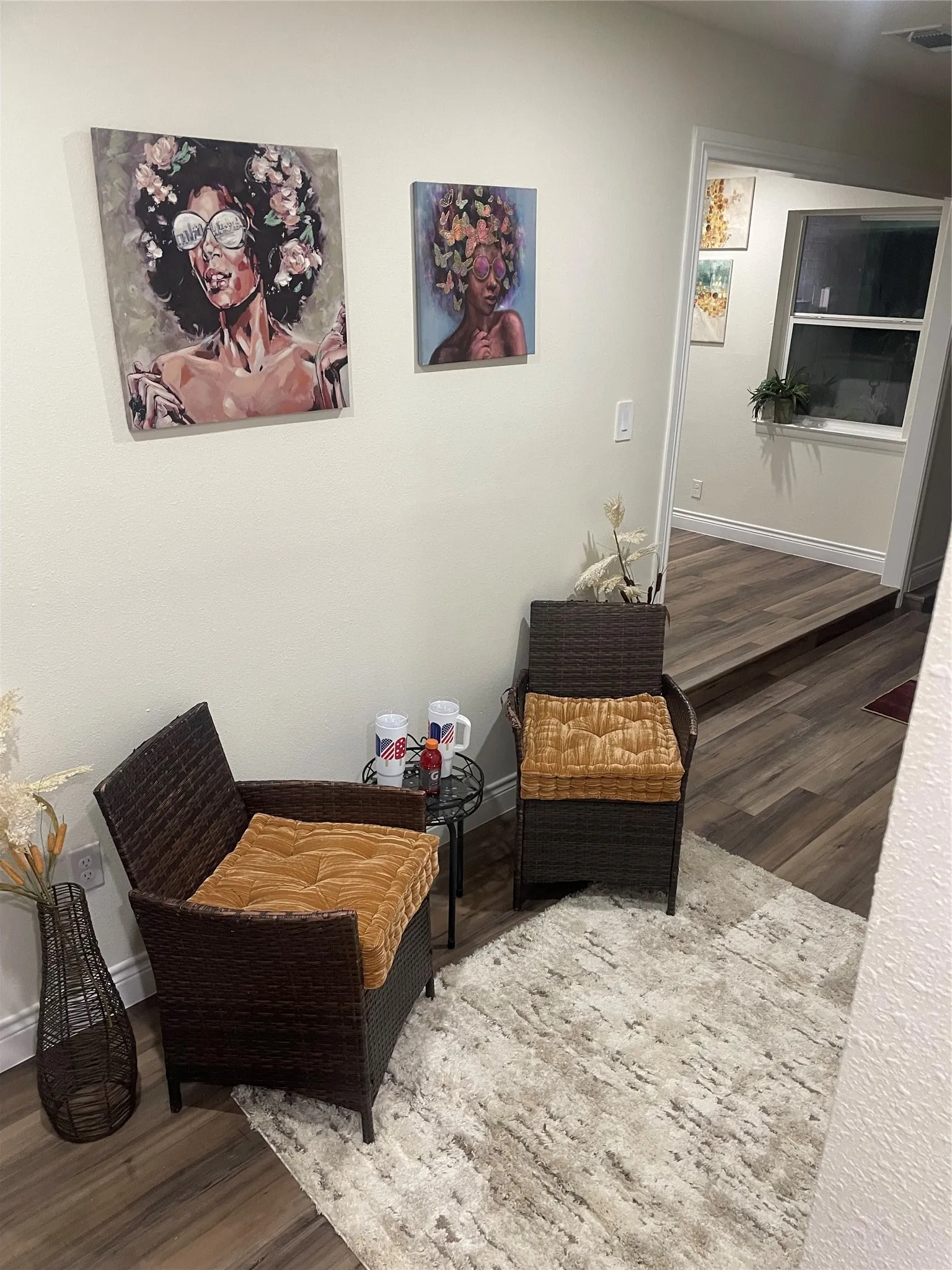 Wood-finish flooring throughout, complemented by light-toned wall finishes