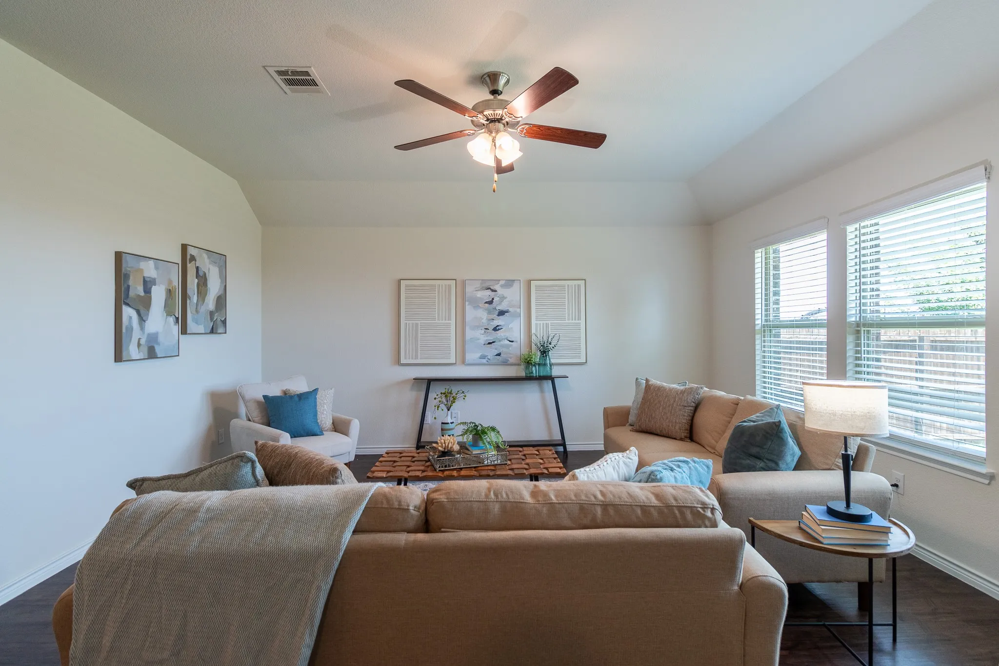 Vaulted ceiling with a ceiling fan and recessed lighting