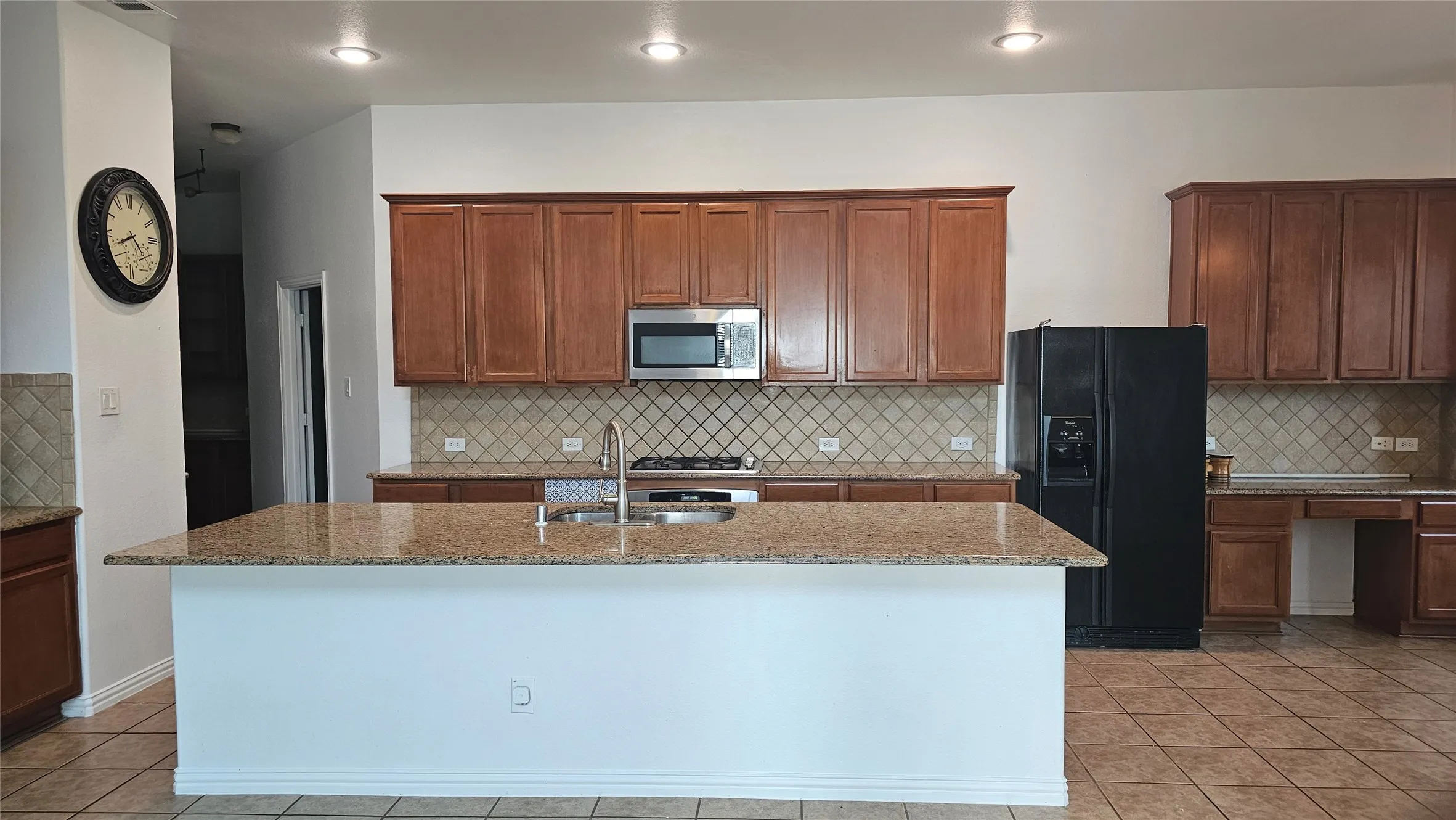 Kitchen island with integrated double basin sink and stainless steel faucet