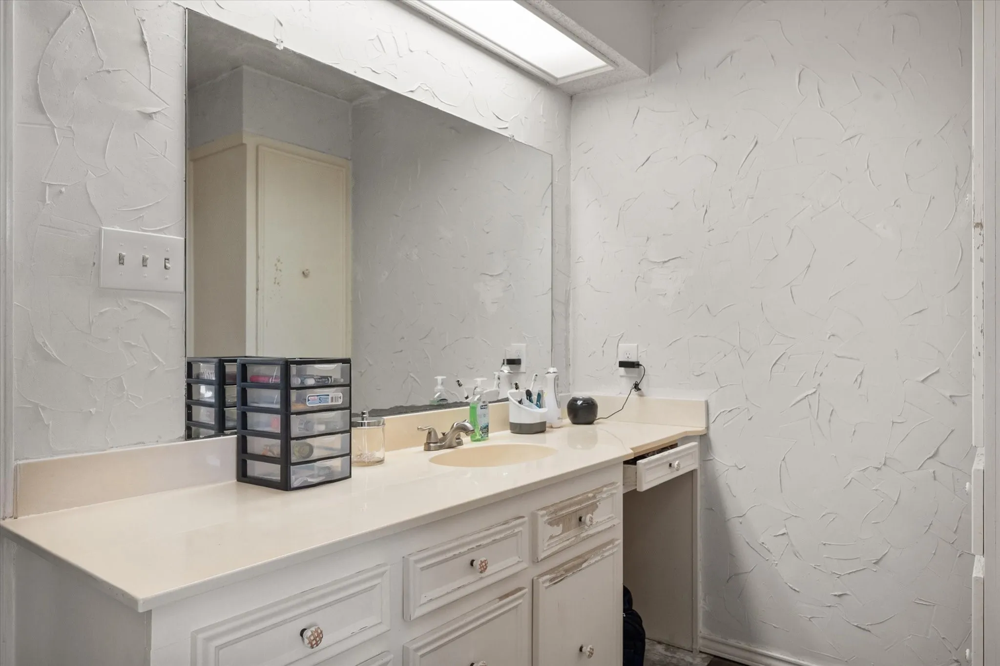 Primary bath has SEPARATE his and her vanities.
