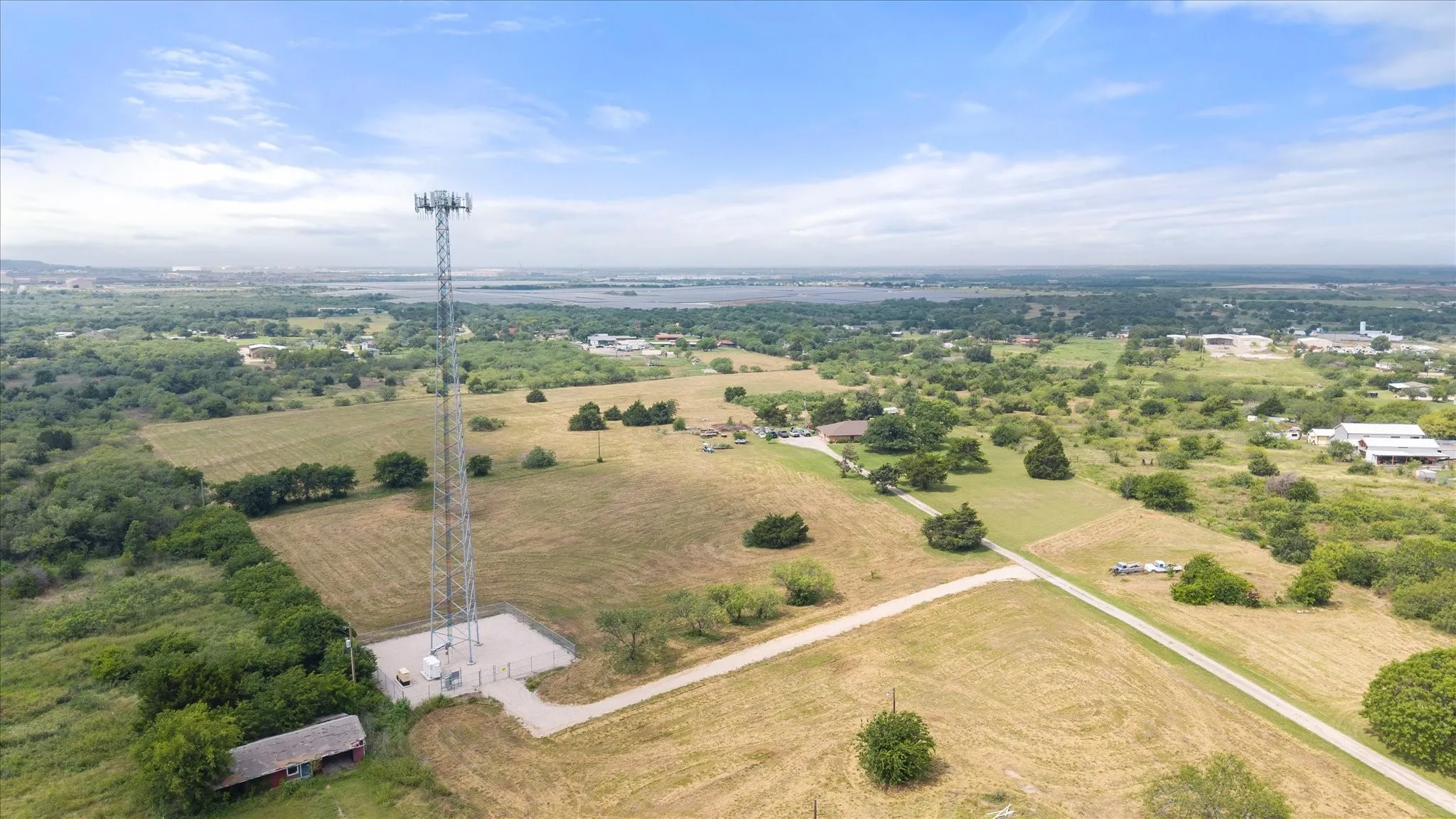 Cell phone tower is under a 40 year lease which began in 2024. The lease is for 75' x75' with an easement to it. The current easment driveway doesn't match the survey exactly, as it was rerouted (it can be moved) to go around the well.