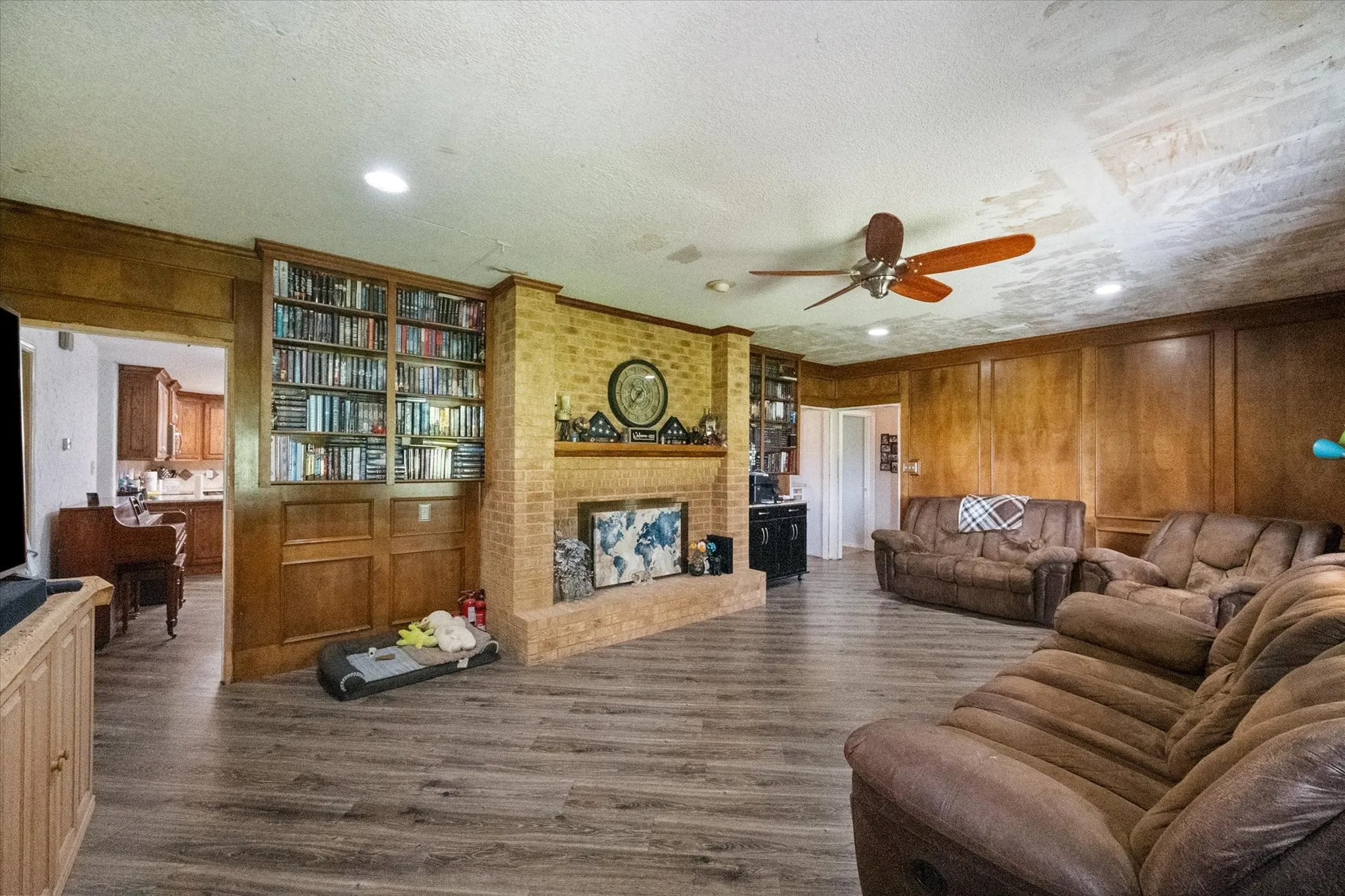 Huge living room with wood burning fireplace.