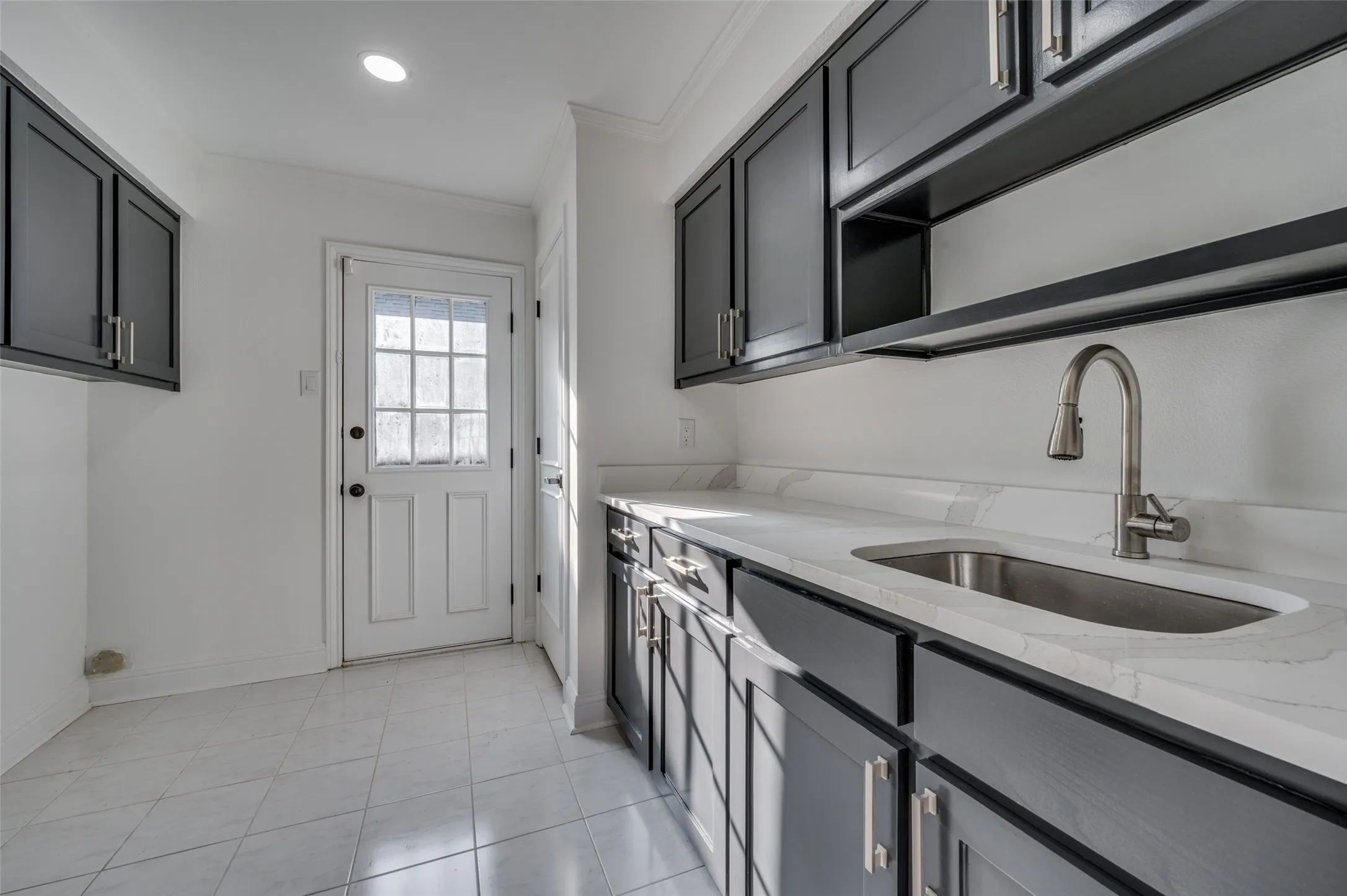 Utility room with sink and room for 2nd refrigerator