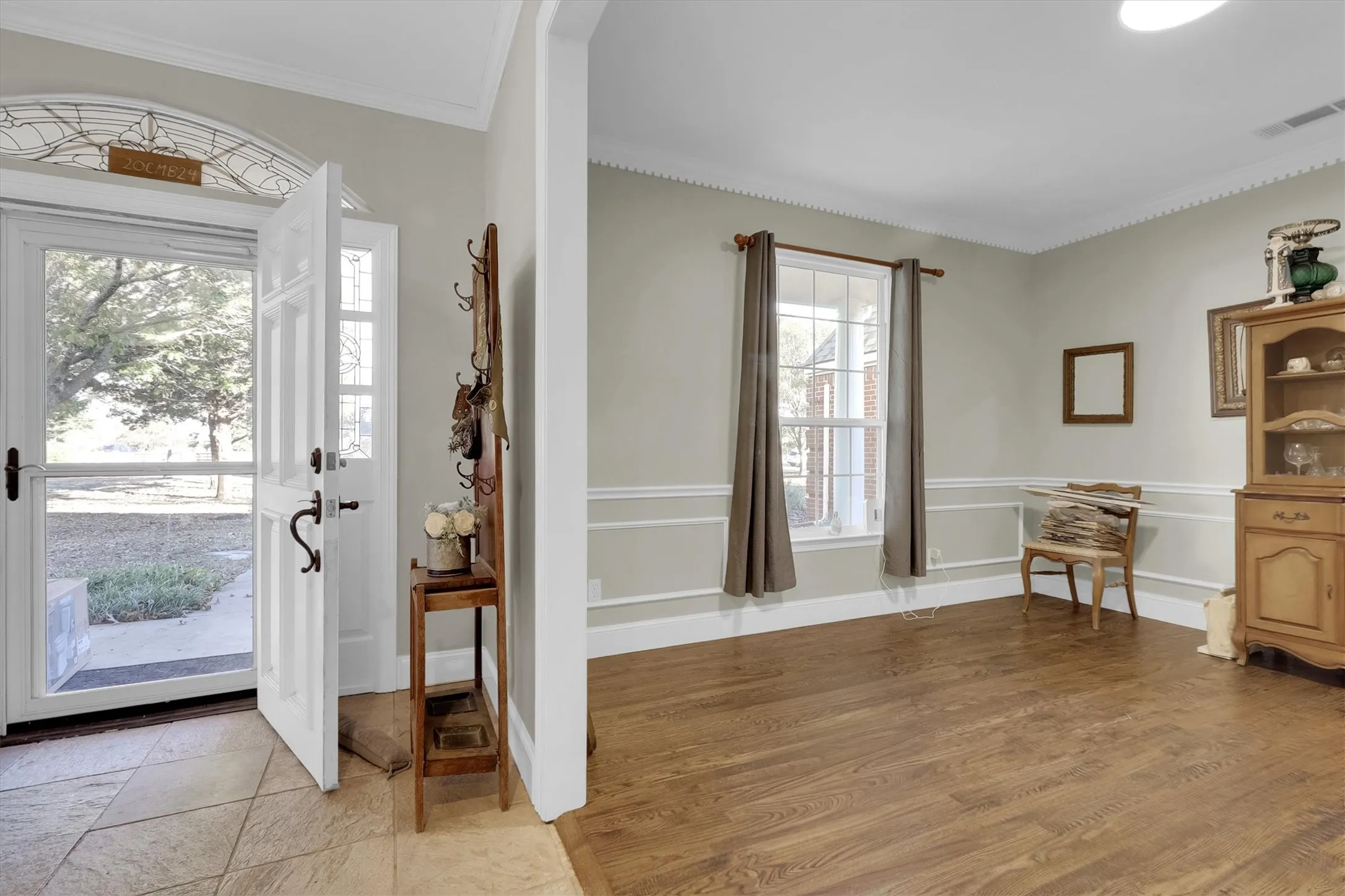 Entryway featuring ornamental molding