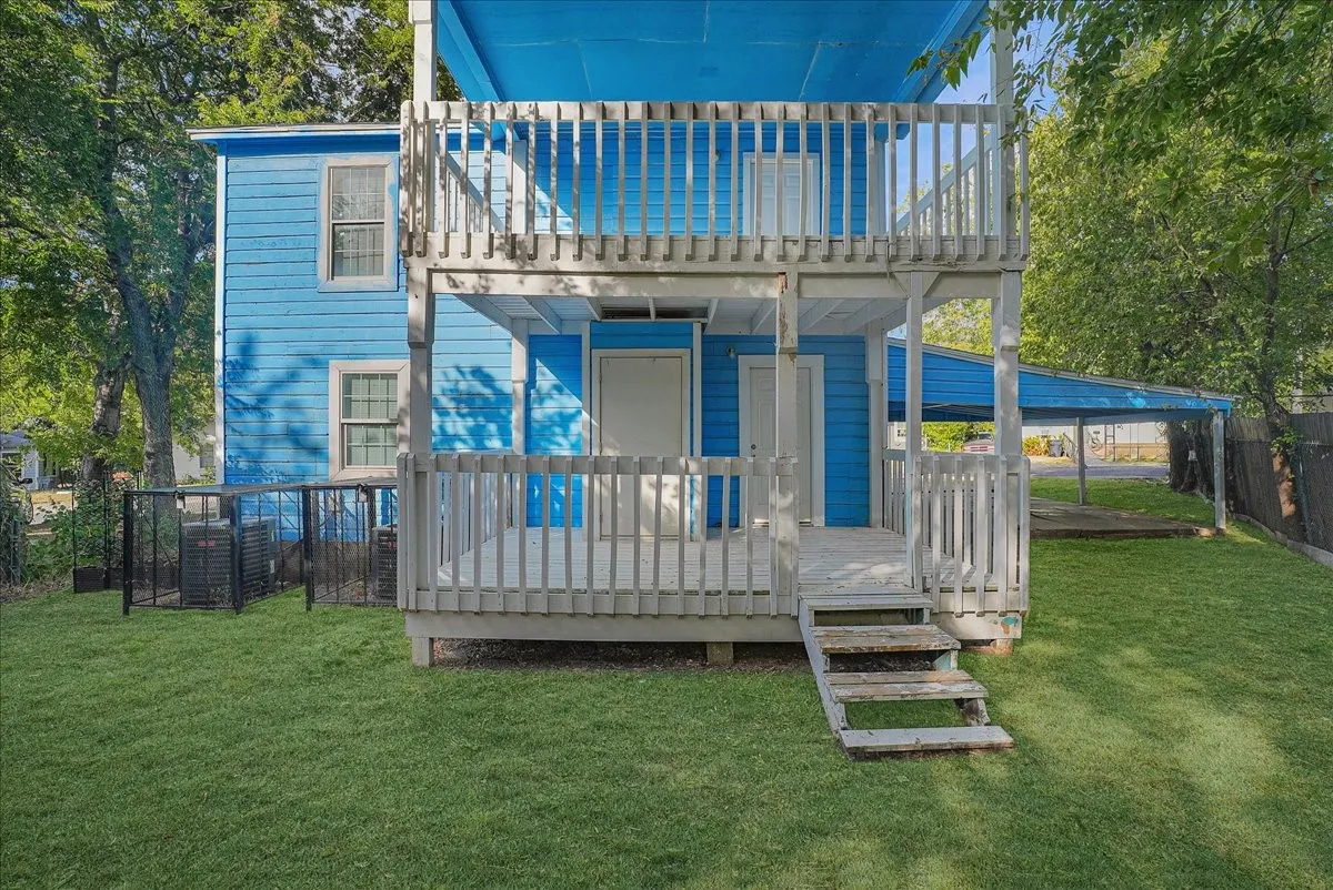 Two-story exterior with vibrant blue siding