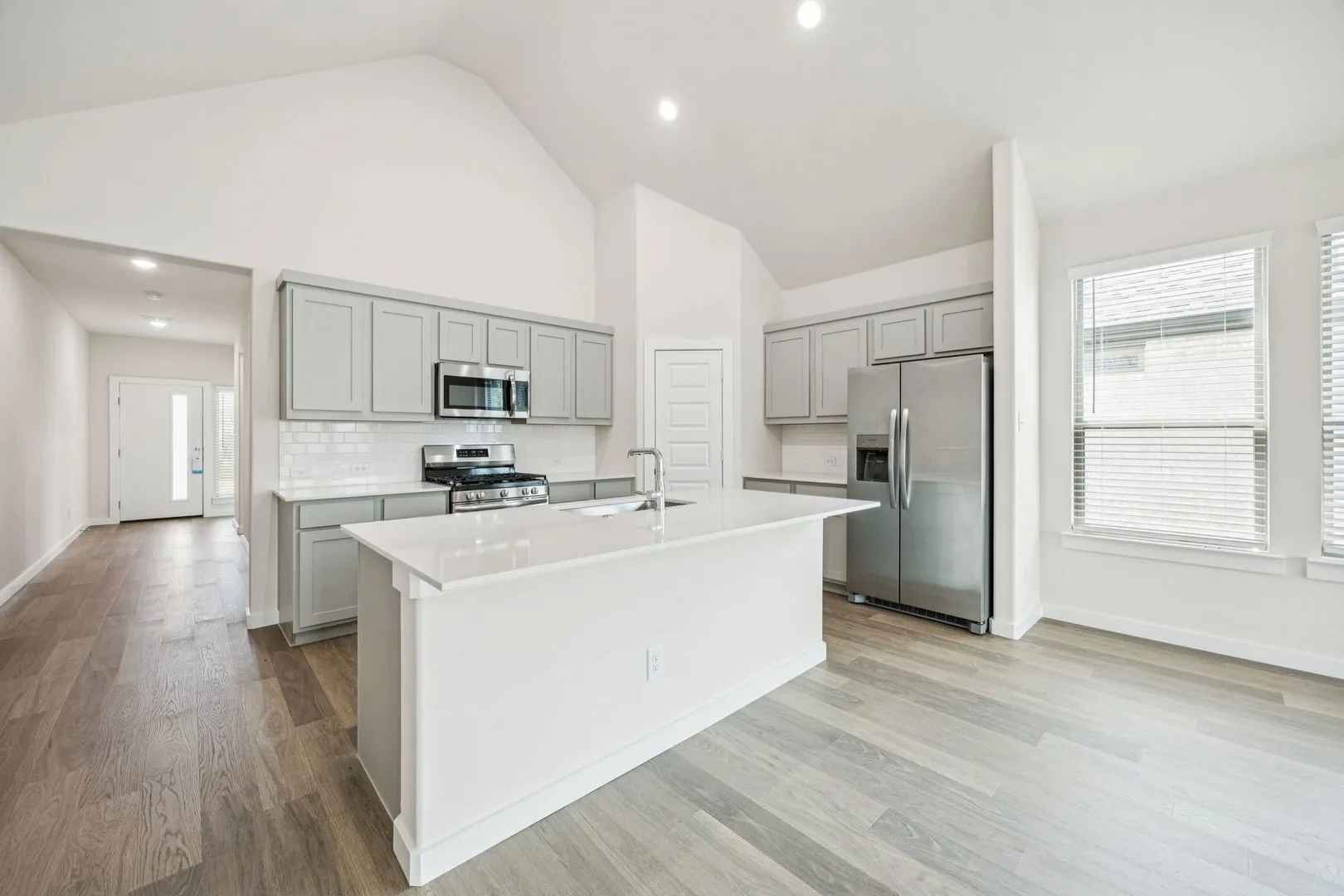 Kitchen in the Claret home plan by Trophy Signature Homes – REPRESENTATIVE PHOTO