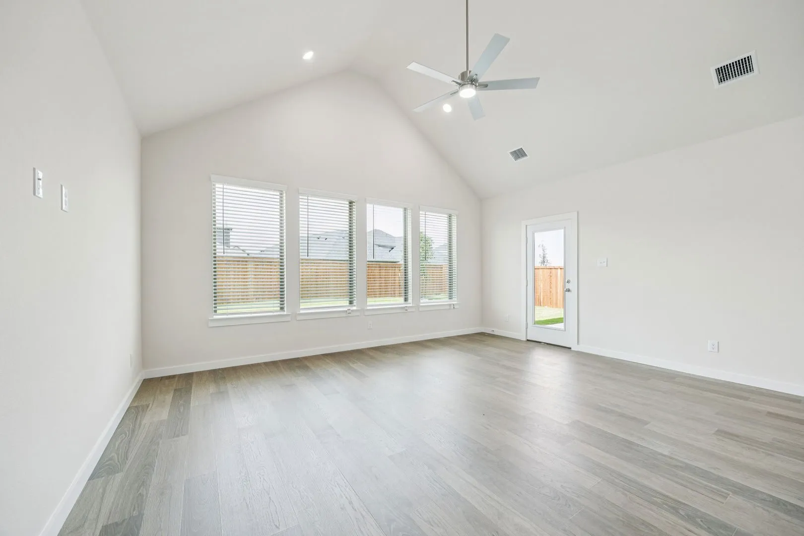 Living Room in the Claret home plan by Trophy Signature Homes – REPRESENTATIVE PHOTO