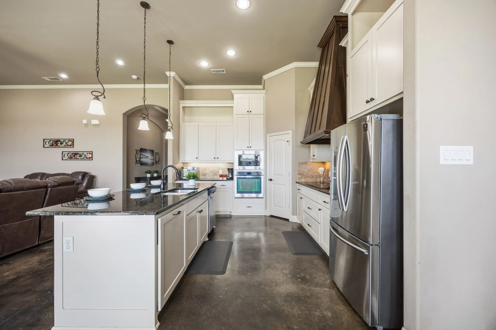 Ample cabinetry. Built in trash + recycle.
