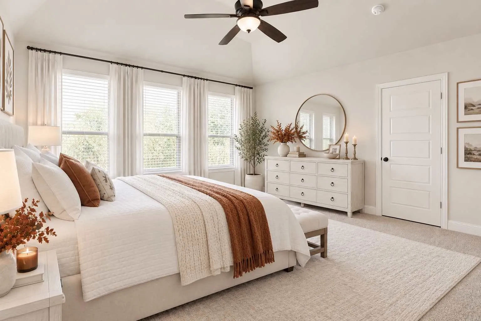 Virtually staged-Vaulted ceiling with a ceiling fan, multiple windows with blinds, light-colored carpeting, and a five-panel interior door