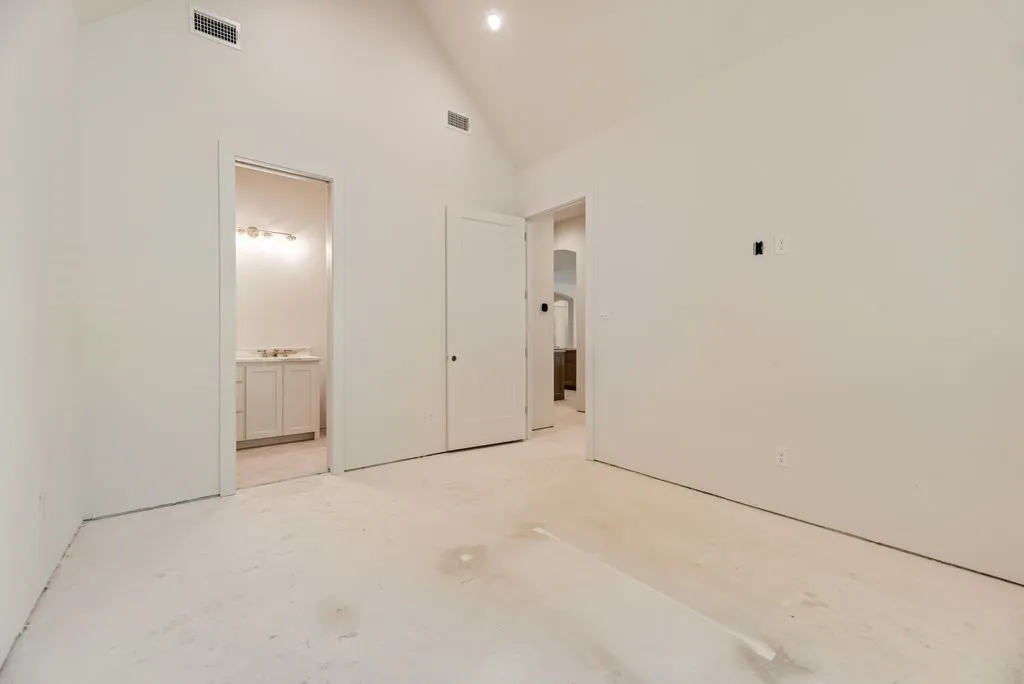 Downstairs secondary bedroom with en suite bathroom.