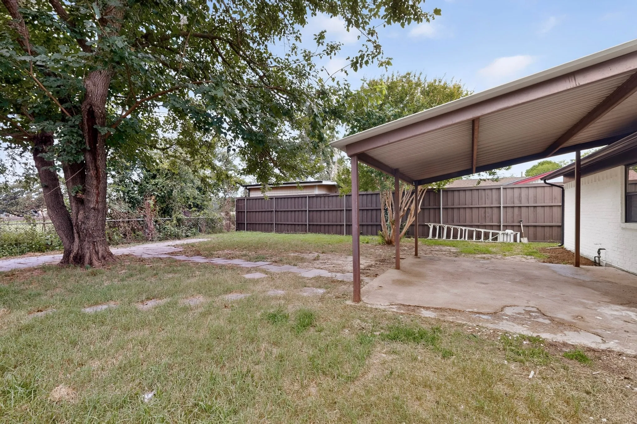 Carport with concrete slab and direct access to the home