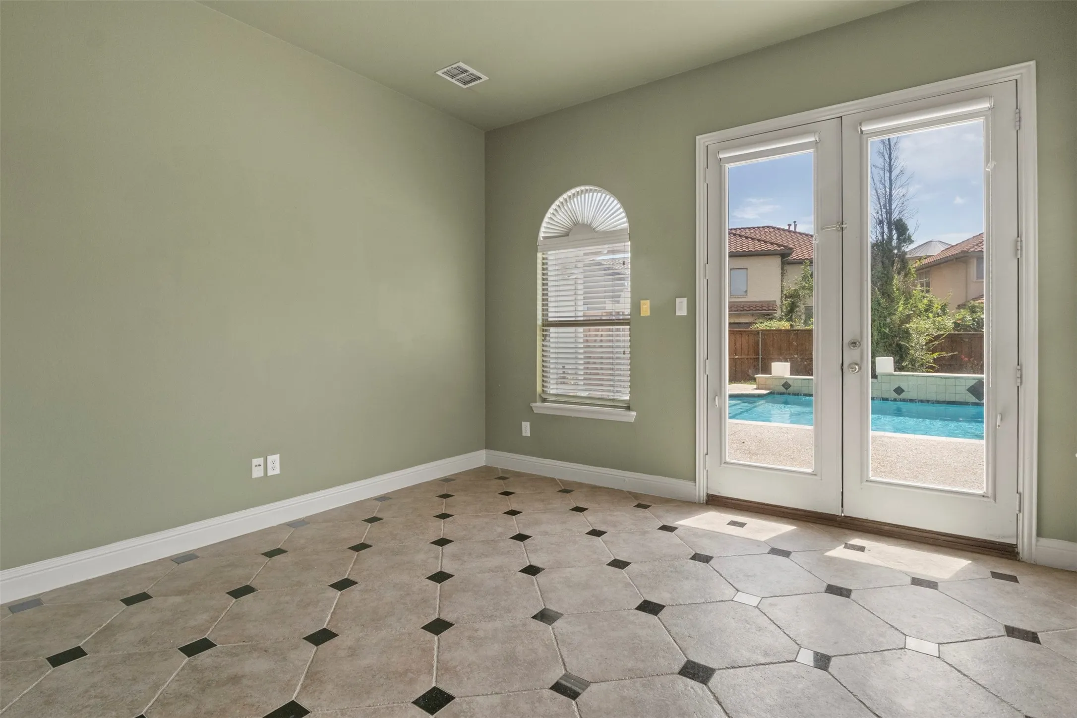 A wonderful space leading to the pool.  Can be used as an office, lounge, or playroom.
