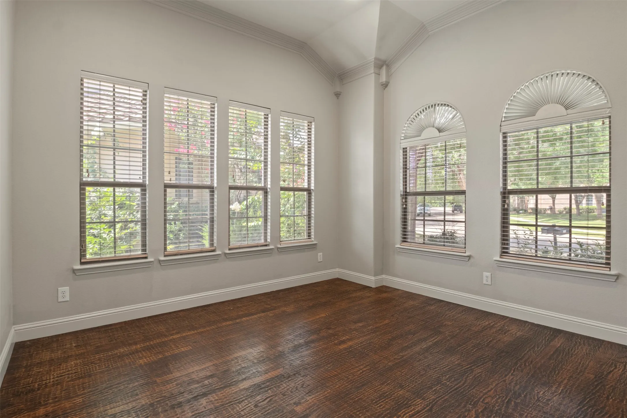This gorgeous light filled room can be a dining room, living room or home office.