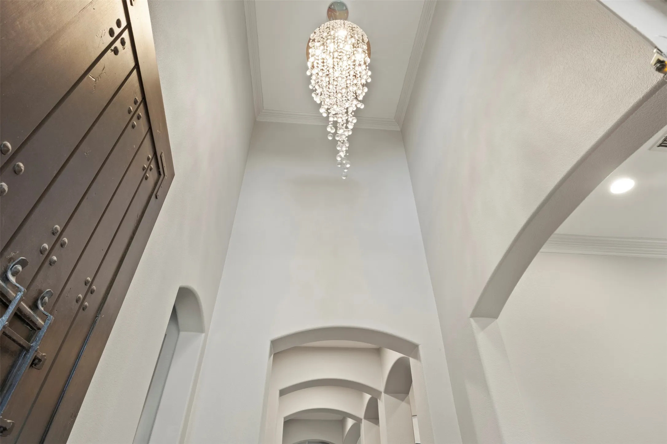 Designer light fixture in the entry sets the tone.