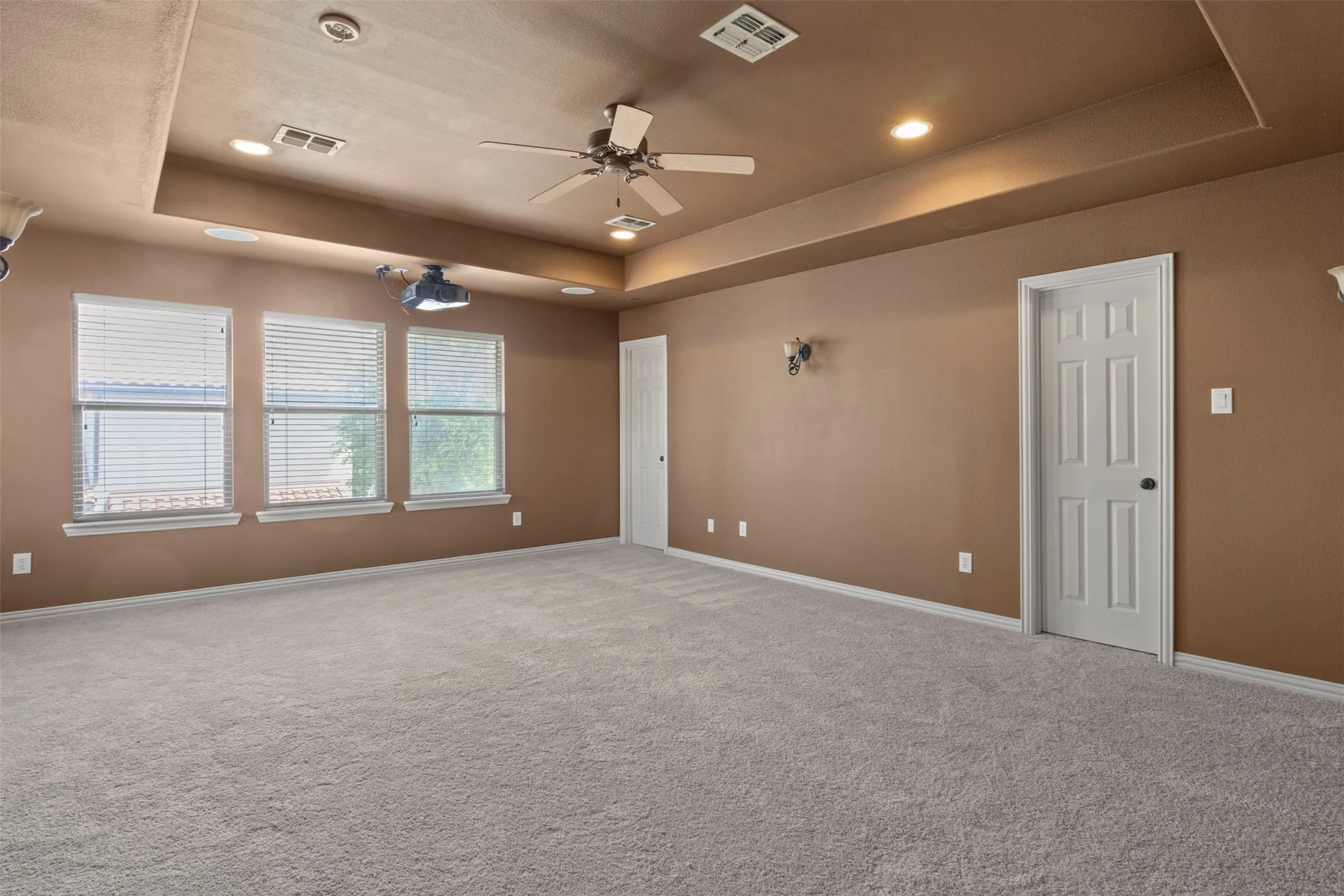 Upstairs bedroom has new carpet and a tray ceiling.