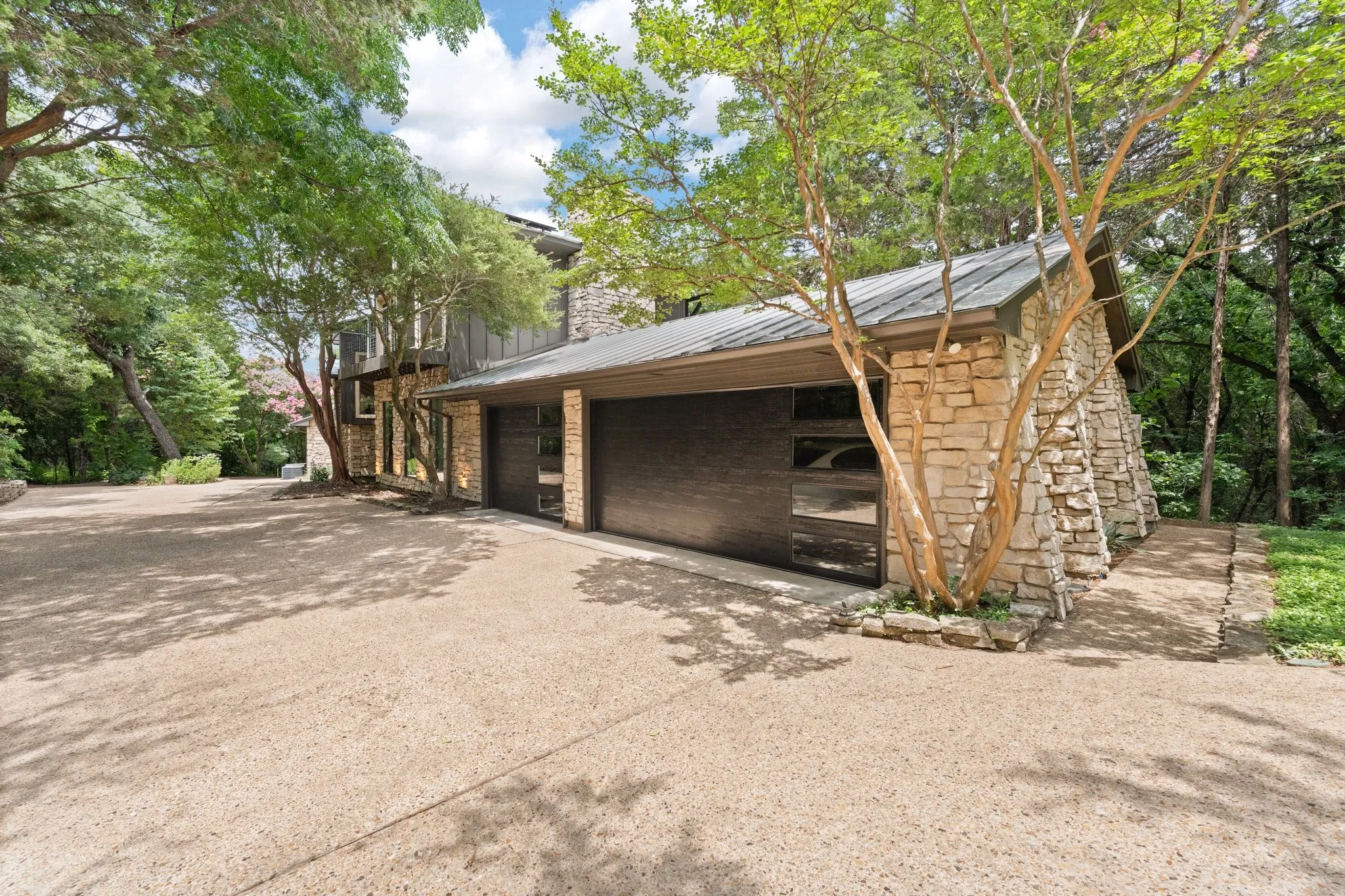 Three car garage featuring new doors and openers
