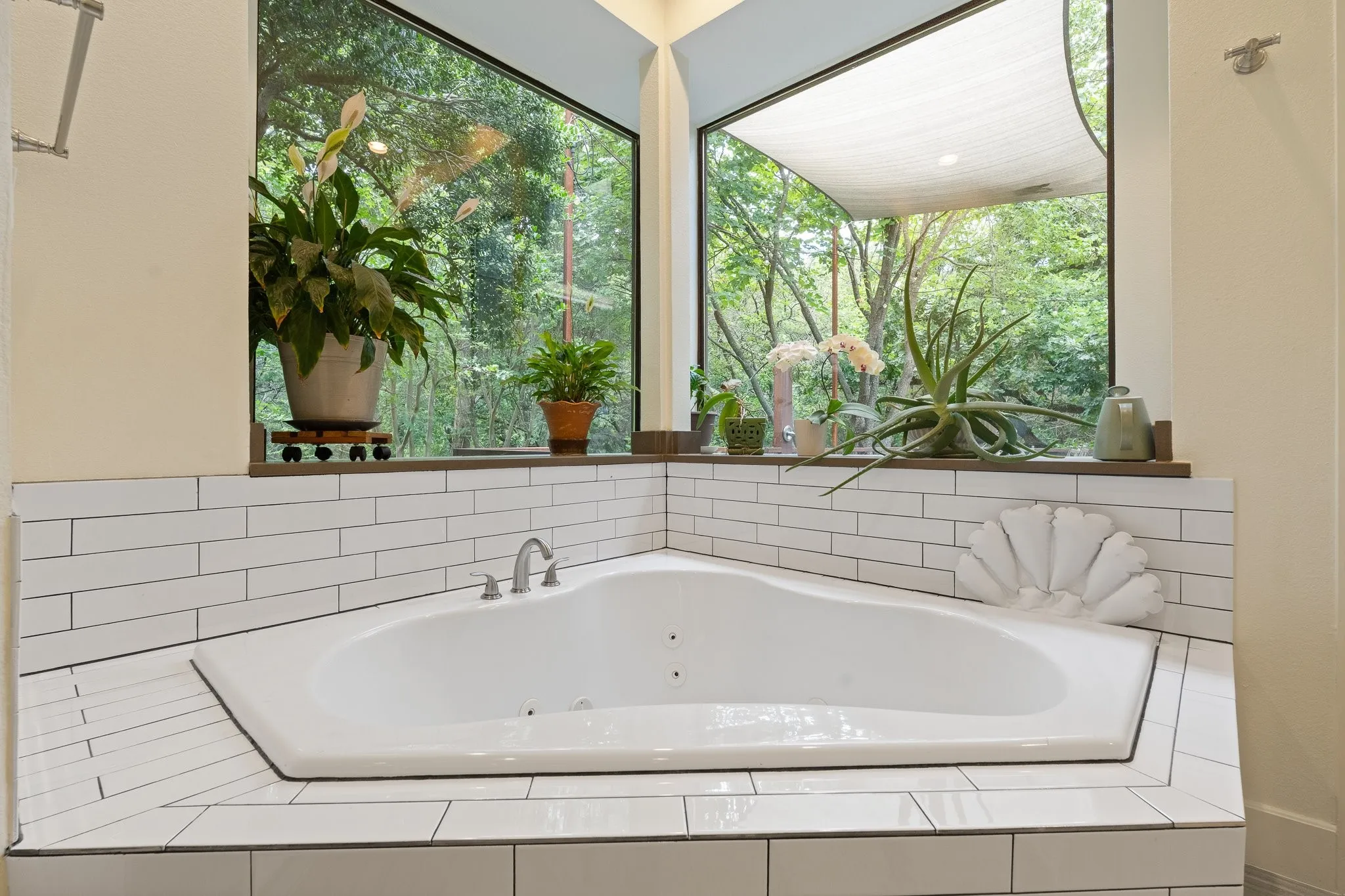 Corner jetted soaking tub overlooking the backyard and patios - plenty of natural light yet relaxing at any time of the day