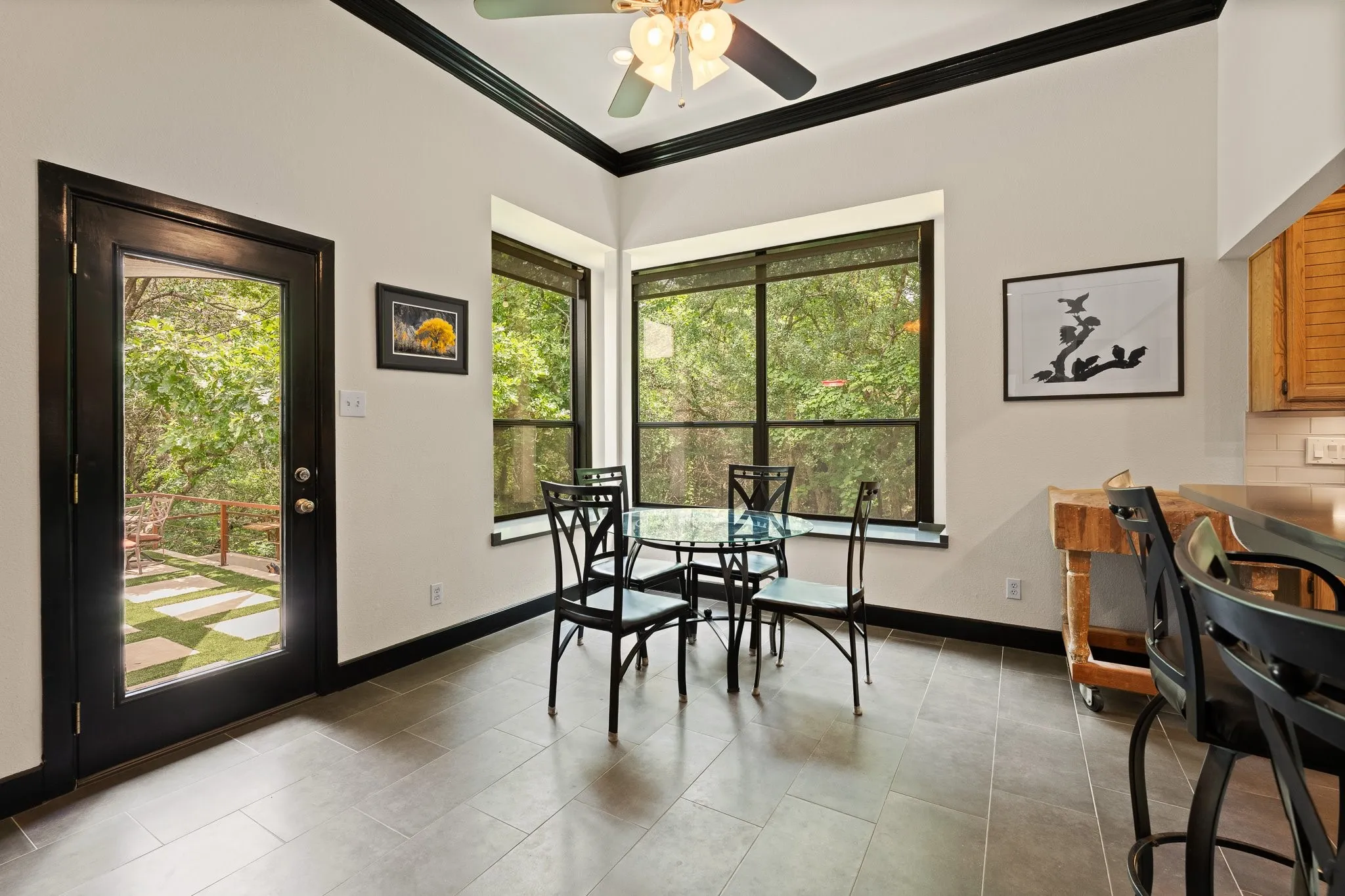 Eat in breakfast area in the kitchen, door leading out to the expansive patio and backyard