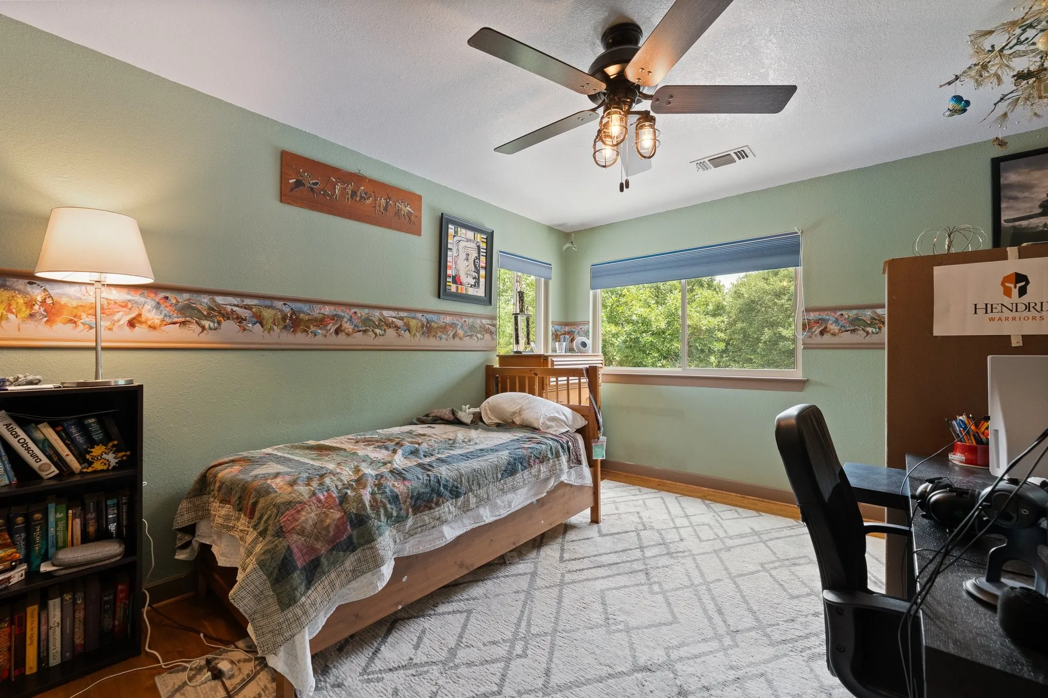 Bedroom upstairs in back of home that overlooks the backyard and lush landscape - it truly feels like you are perched in a treehouse, so relaxing and serene
