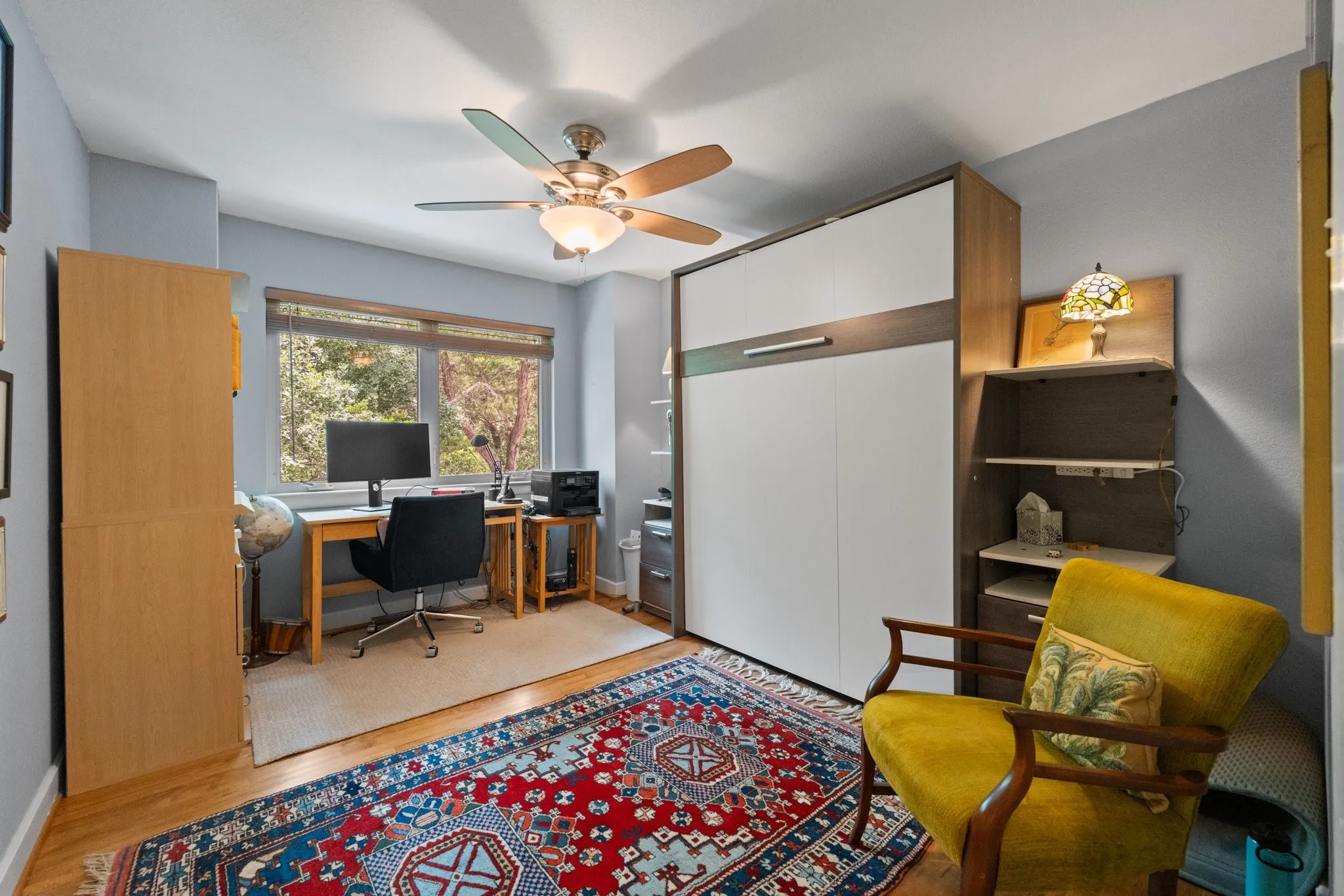 Office overlooking the backyard featuring Murphy Bed, will stay with the home