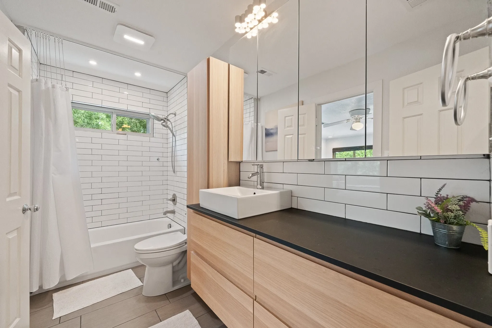 Beautifully renovated upstairs bathroom - windows are operable to allow natural air flow