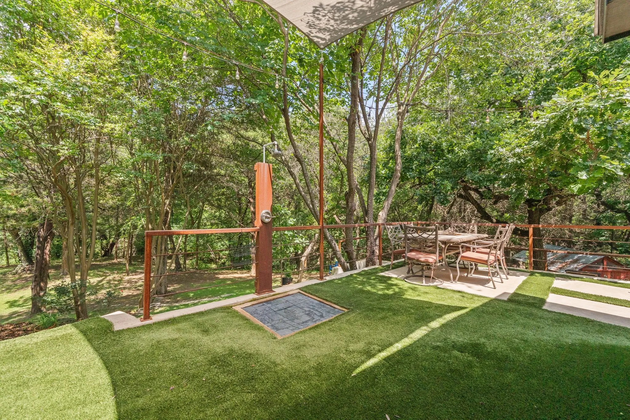 Outdoor patio featuring artificial turf  and your own outdoor shower! You won't find this privacy and outdoor oasis anywhere else in Cedar Hill!