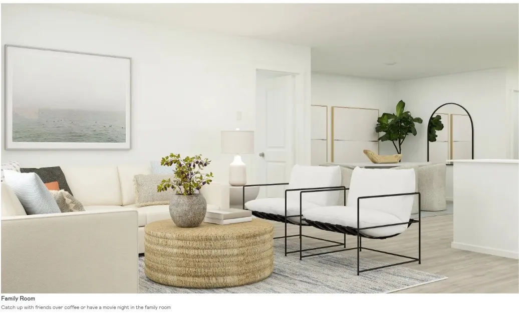 Open concept living area featuring light wood-finish flooring and white painted walls