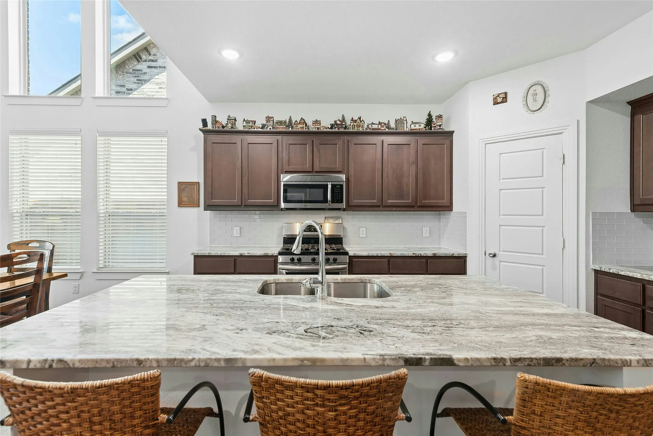 Expanding Kitchen Island w light quartz stone.