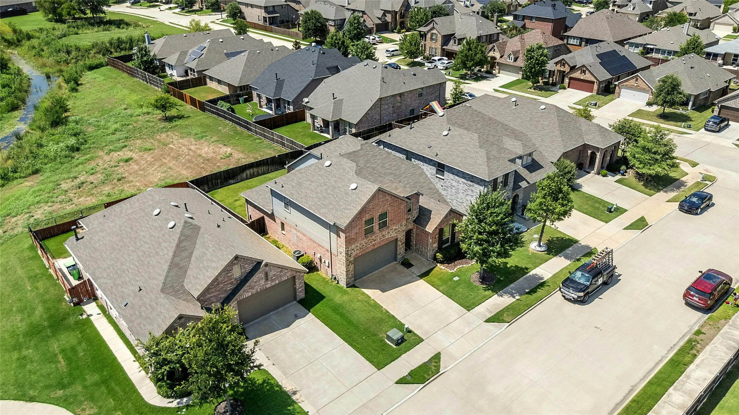 View of Warbler Dr. Backing up to Greenspace.