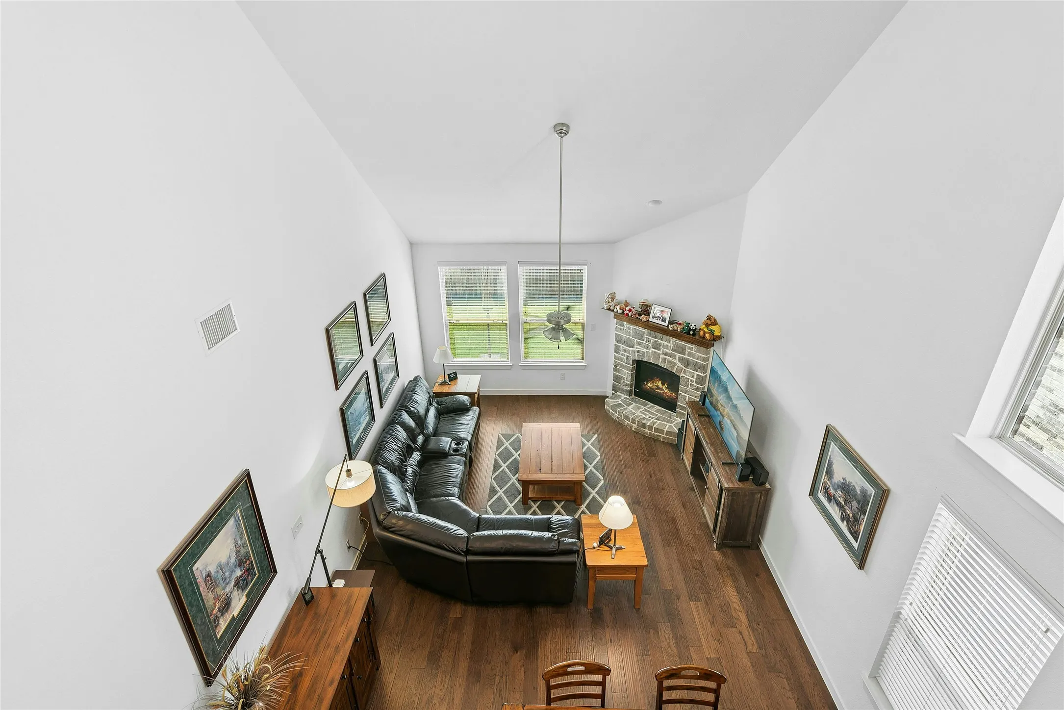 View from Upper Loft Living Room to Lower Living Room.