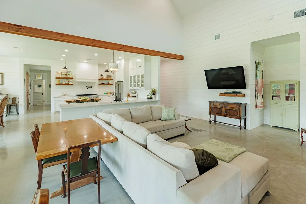 high vaulted ceilings and shiplapped walls with enough space for game table