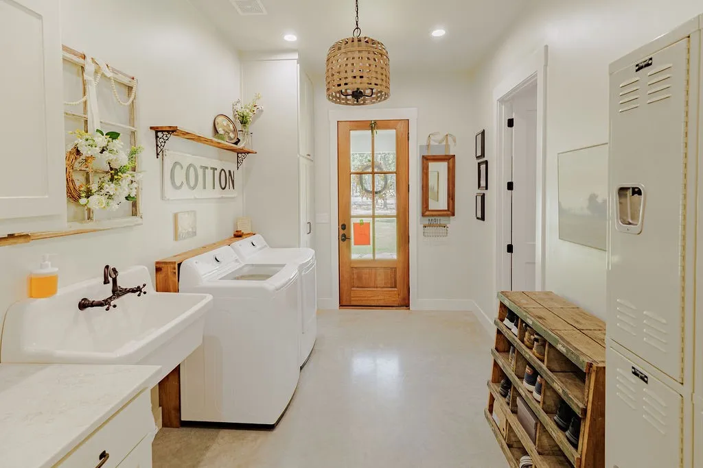 laundry room with ample cabinets, lockers and broom closet