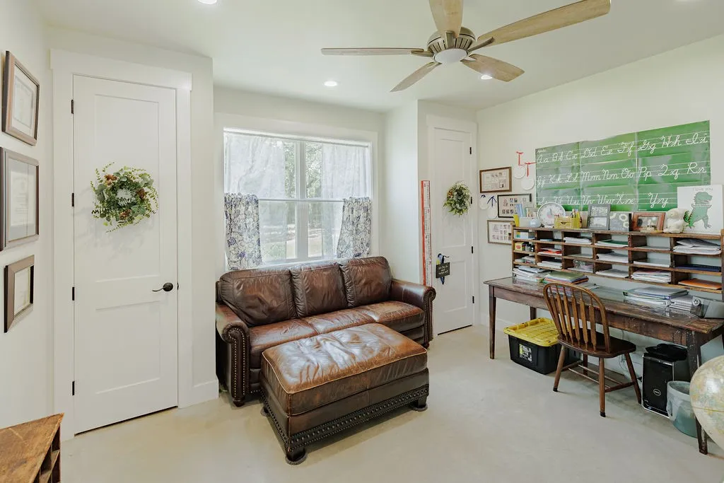 den with two separate storage closets with built in shelves