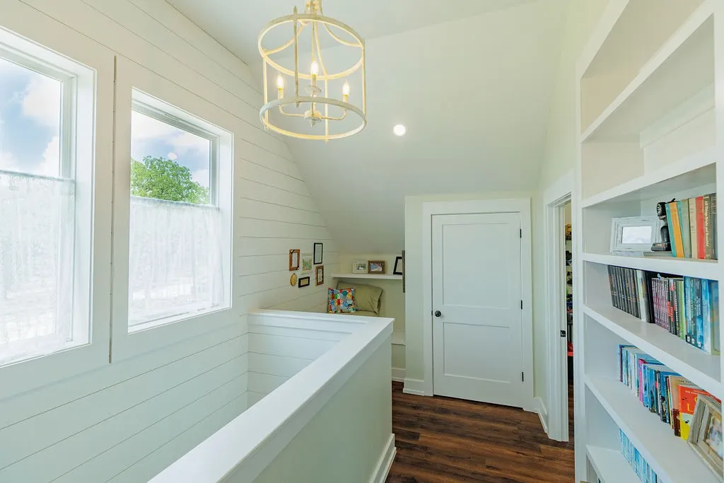upstairs landing with built-in bookshelves and book nook