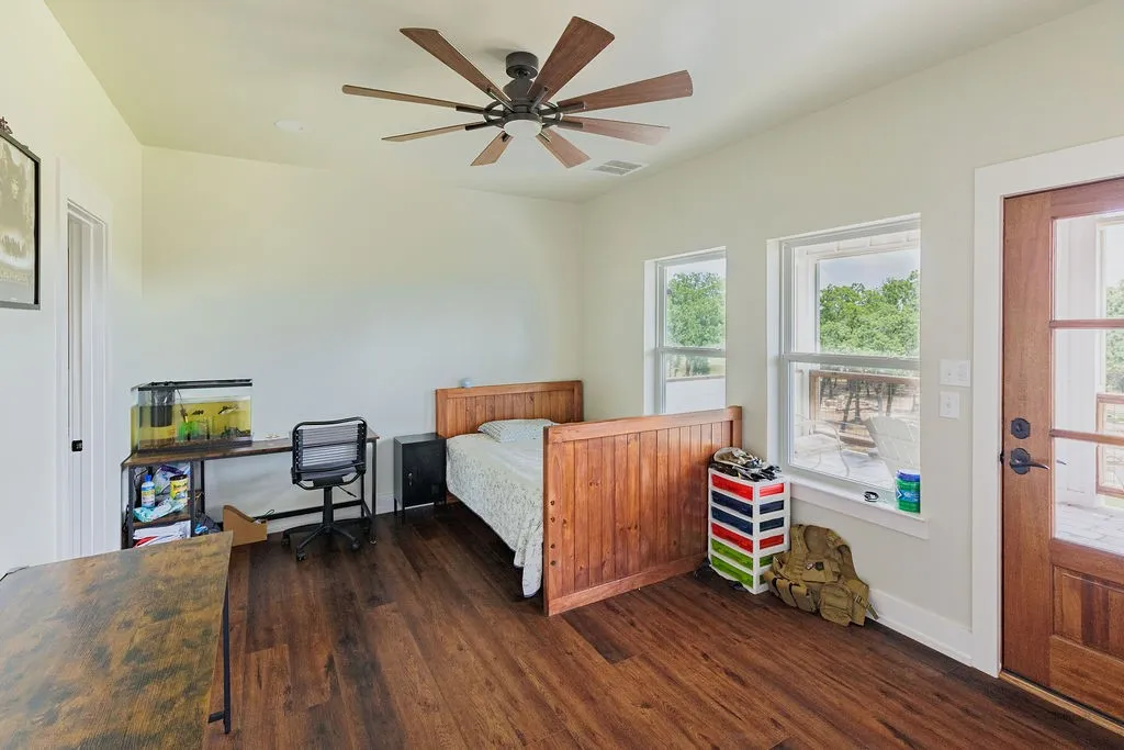 large upstairs bedroom opens to balcony