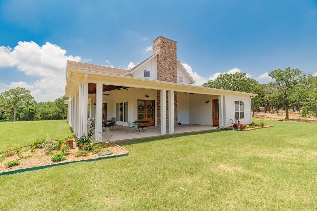 wrap around porch with three outdoor ceiling fans with tongue and groove wood ceiling sealed and conditioned.