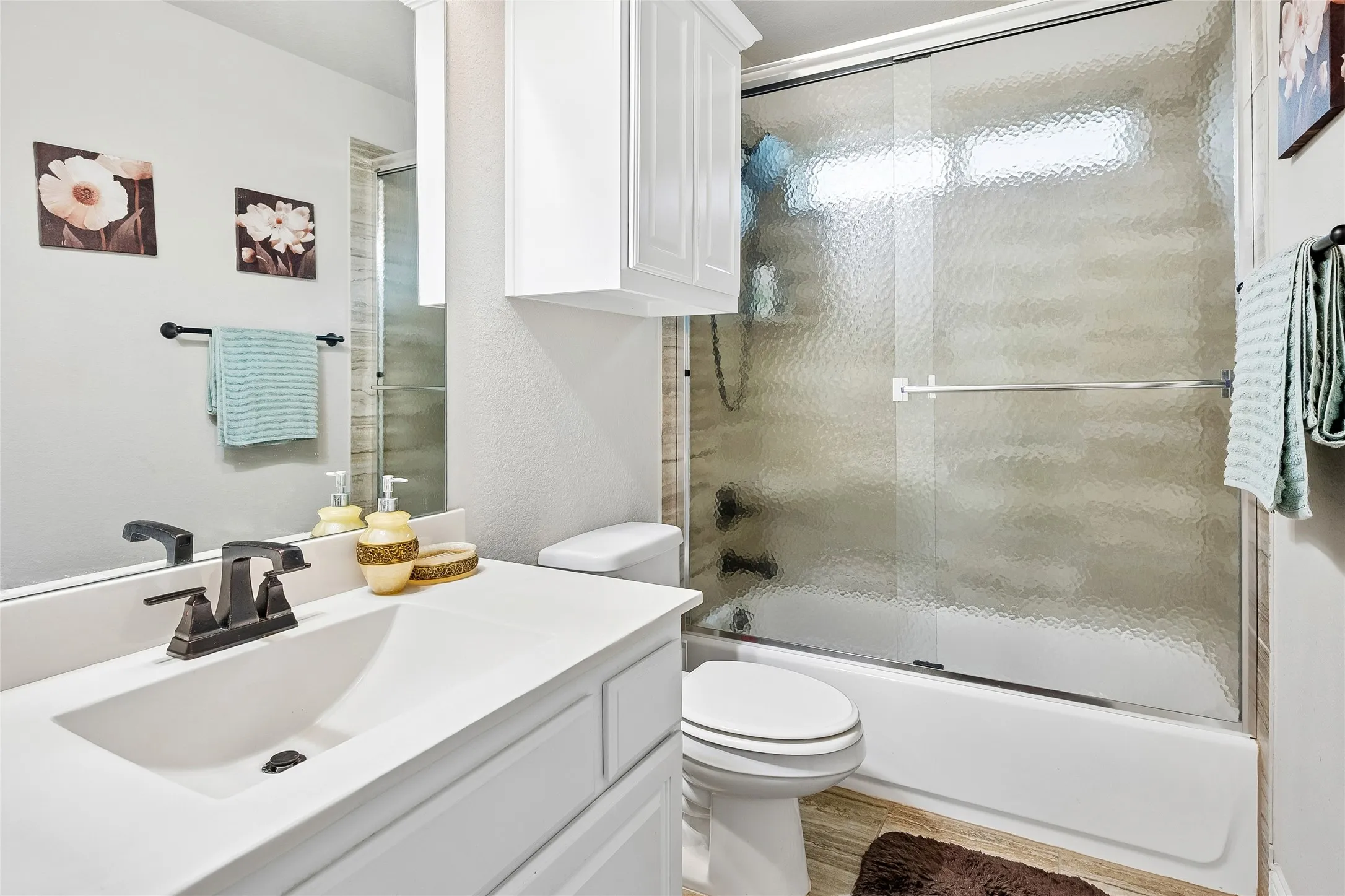 Second upstairs bath with tub and storage