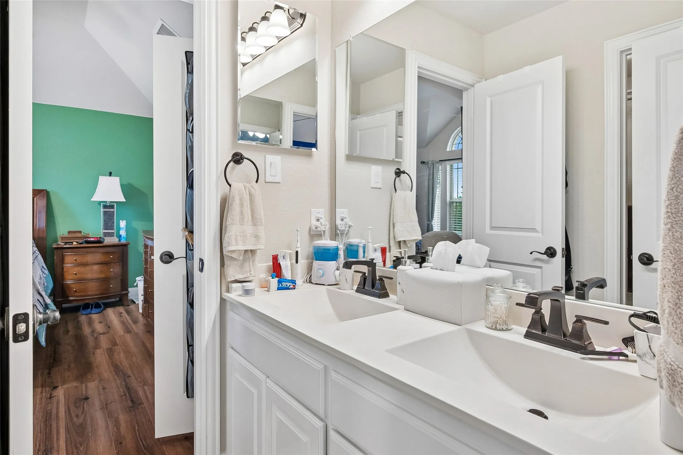 One of two upstairs baths with double sinks