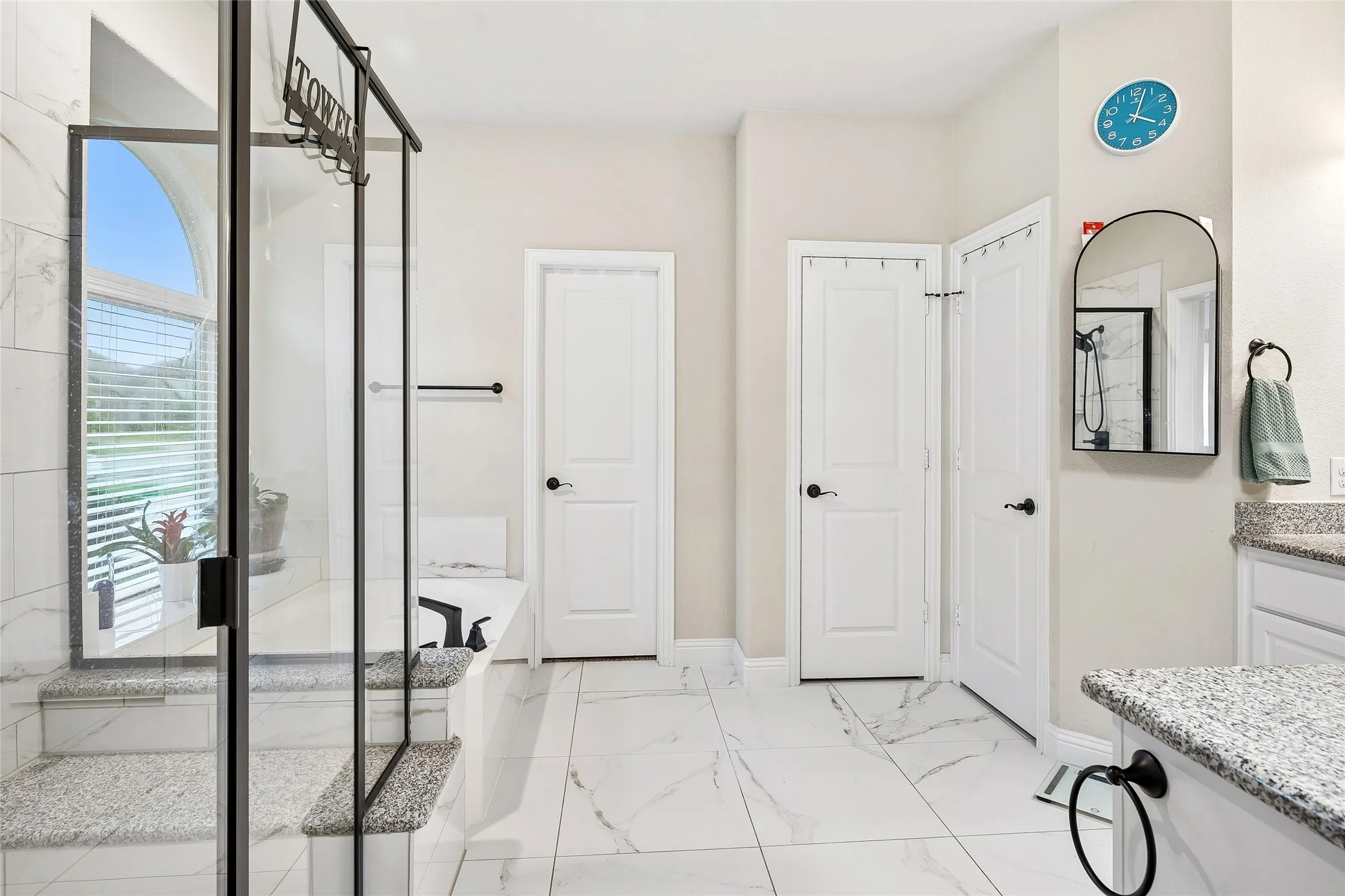 Spa like primary bath with custom tile
