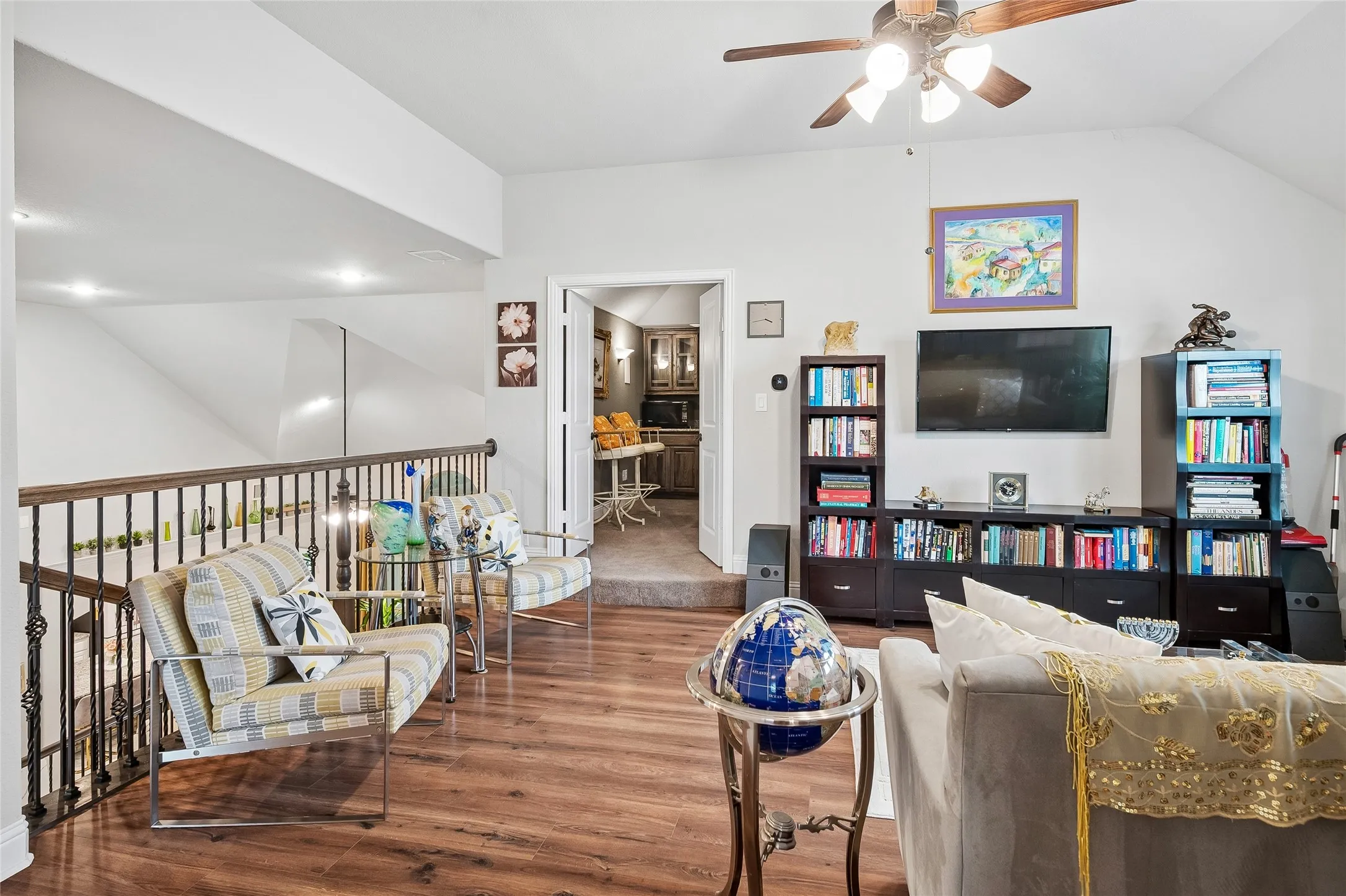 Large loft area with fresh wood floors