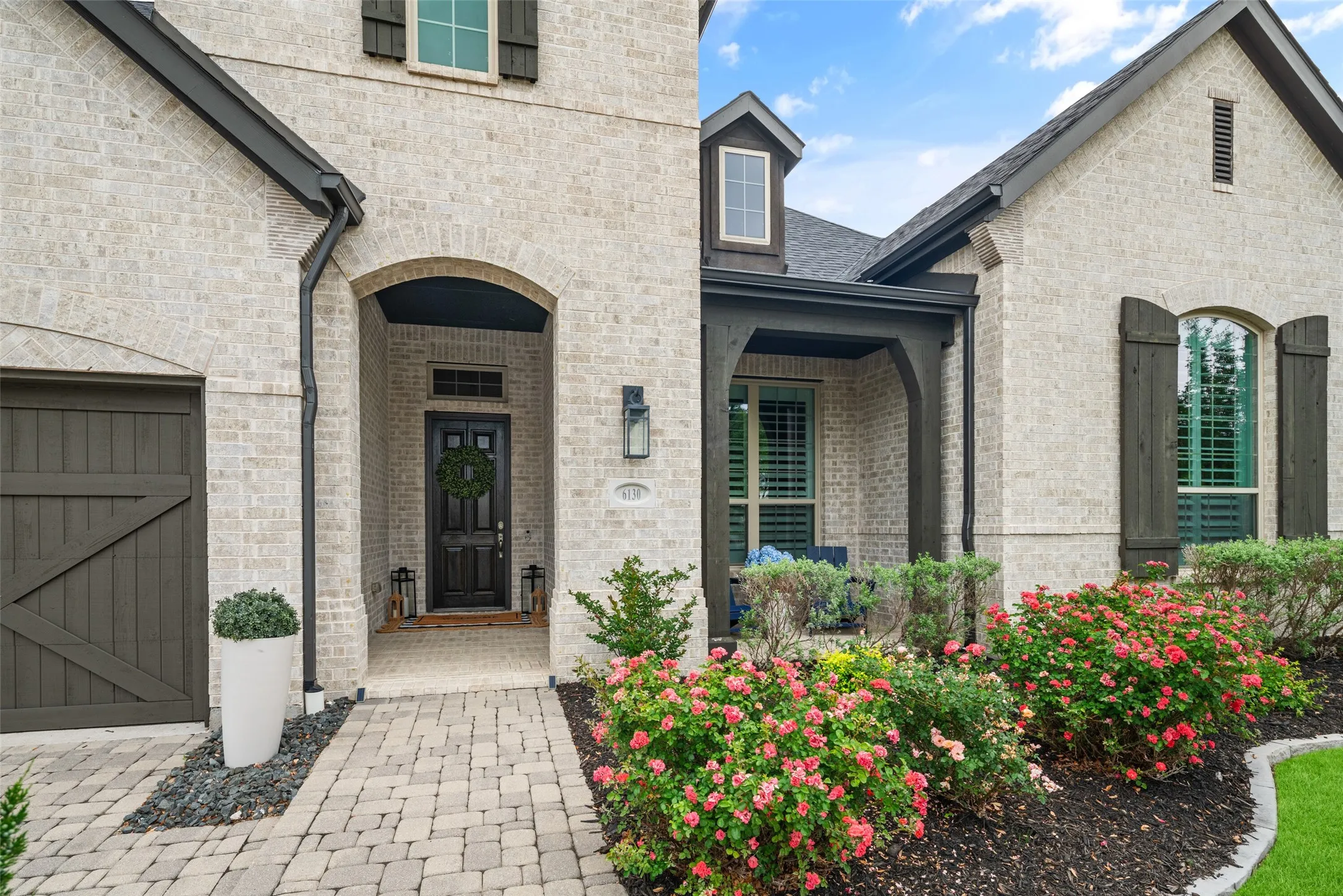 A welcoming covered front porch and elegant entry set the tone for the exceptional craftsmanship and designer finishes found throughout. Combining exceptional curb appeal with an ideal location, this beautiful residence offers luxury living just minutes from premier shopping, dining, entertainment, and top-rated Frisco ISD schools.