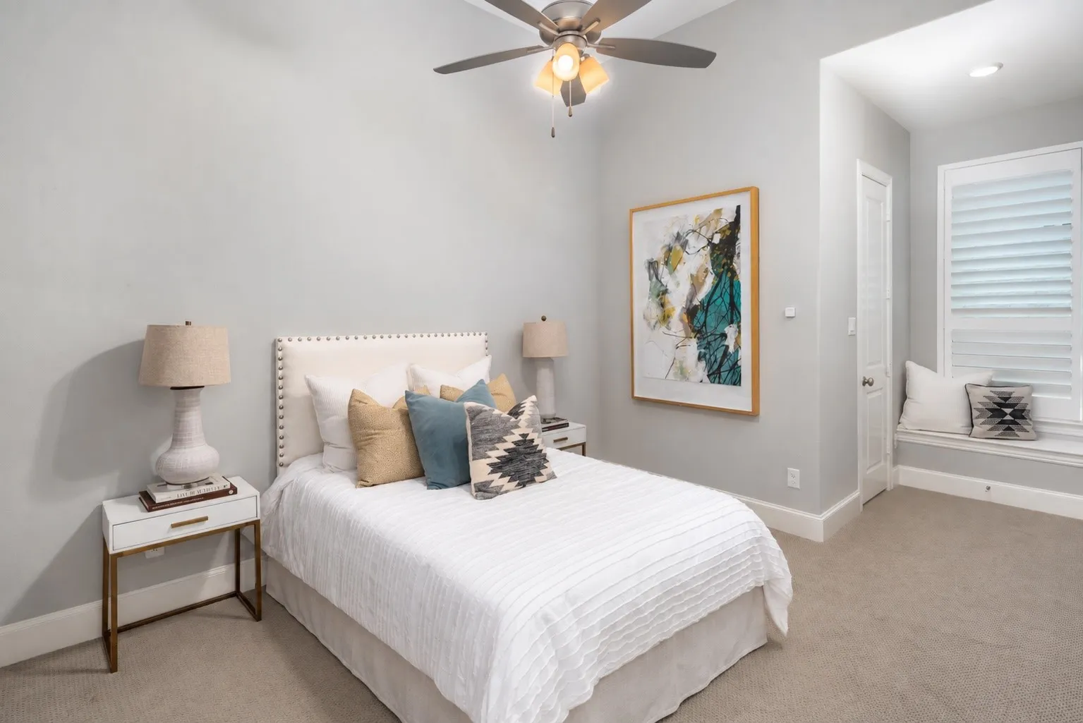 This spacious secondary bedroom offers a private retreat with plush carpeting, a ceiling fan, a generous walk-in closet, and a cozy flex nook that's perfect for a reading area, study space, or play corner. Complete with its own ensuite bathroom, this thoughtfully designed suite provides comfort, privacy, and functionality for family members or guests.