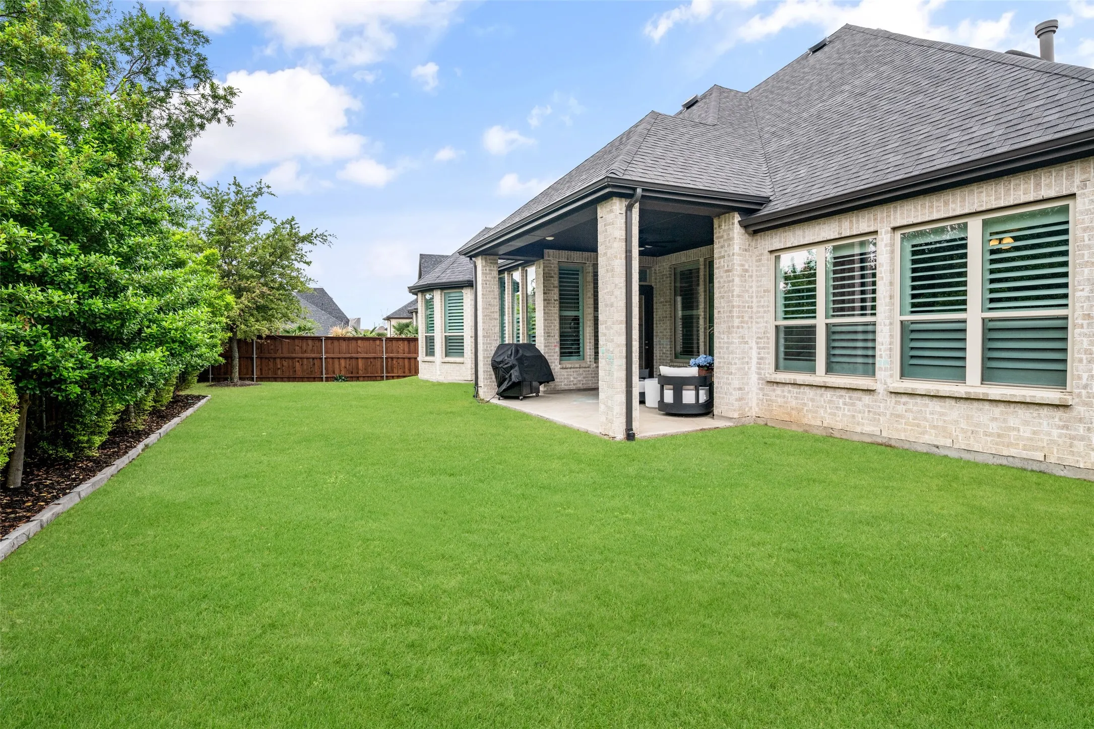 The expansive backyard offers endless possibilities with plenty of room to design your dream pool, create a play area, or enjoy open green space for pets and outdoor activities. Mature landscaping provides a beautiful backdrop, while the covered patio creates the perfect setting for relaxing or entertaining in your own private outdoor retreat.