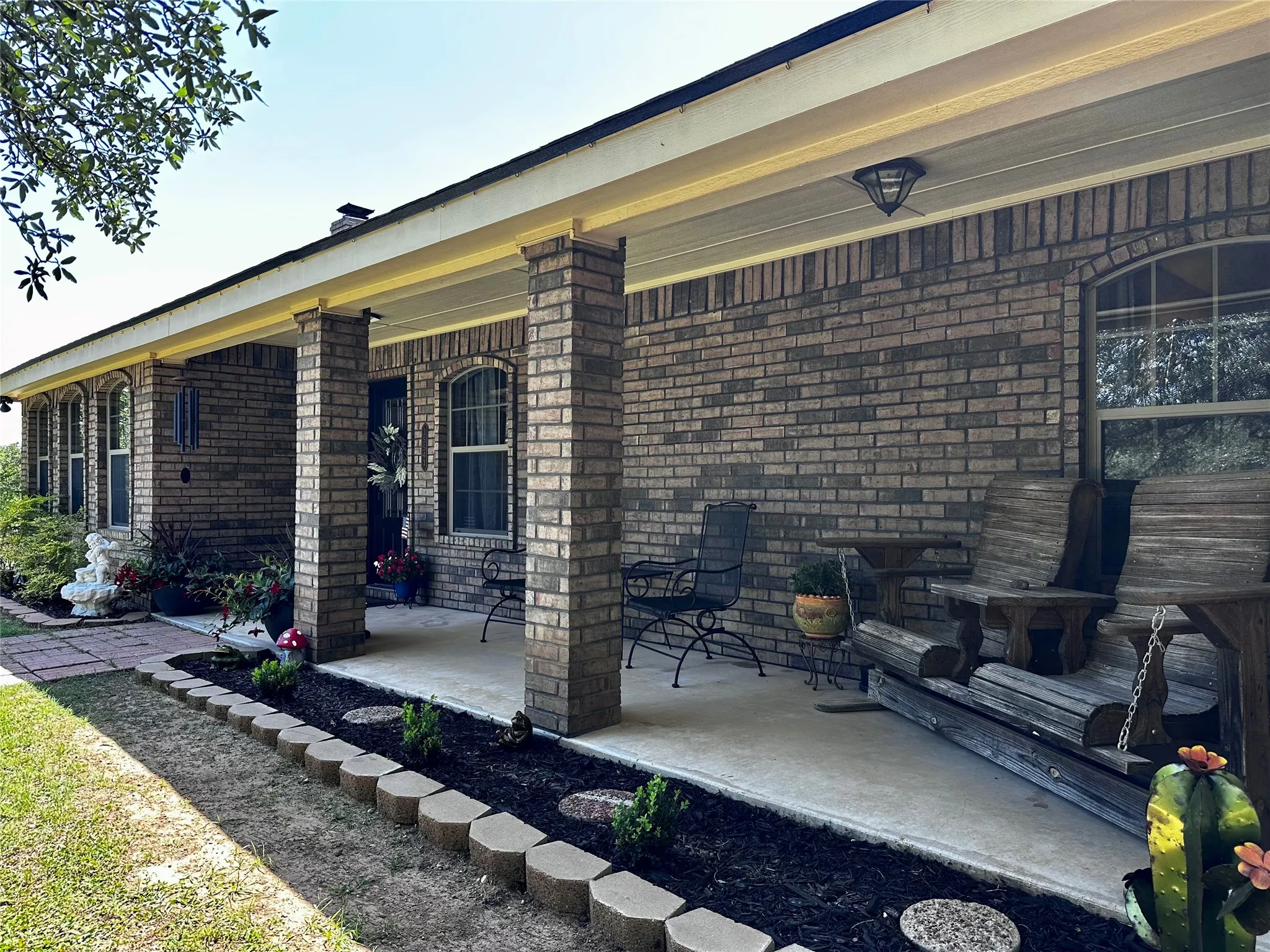 Inviting Front porch with views of scattered Oaks