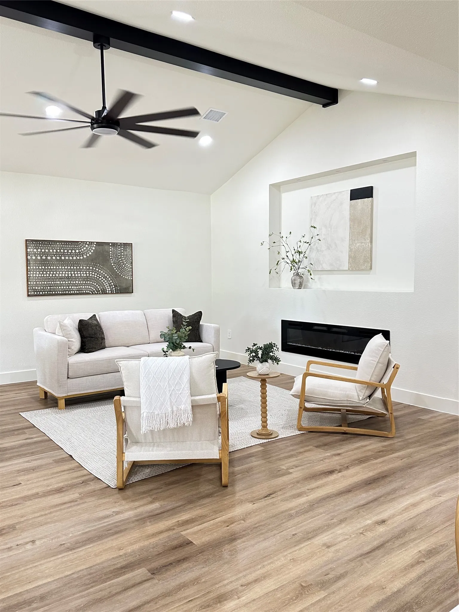 Large living room, high ceilings, electric fireplace & wired for up to 80”