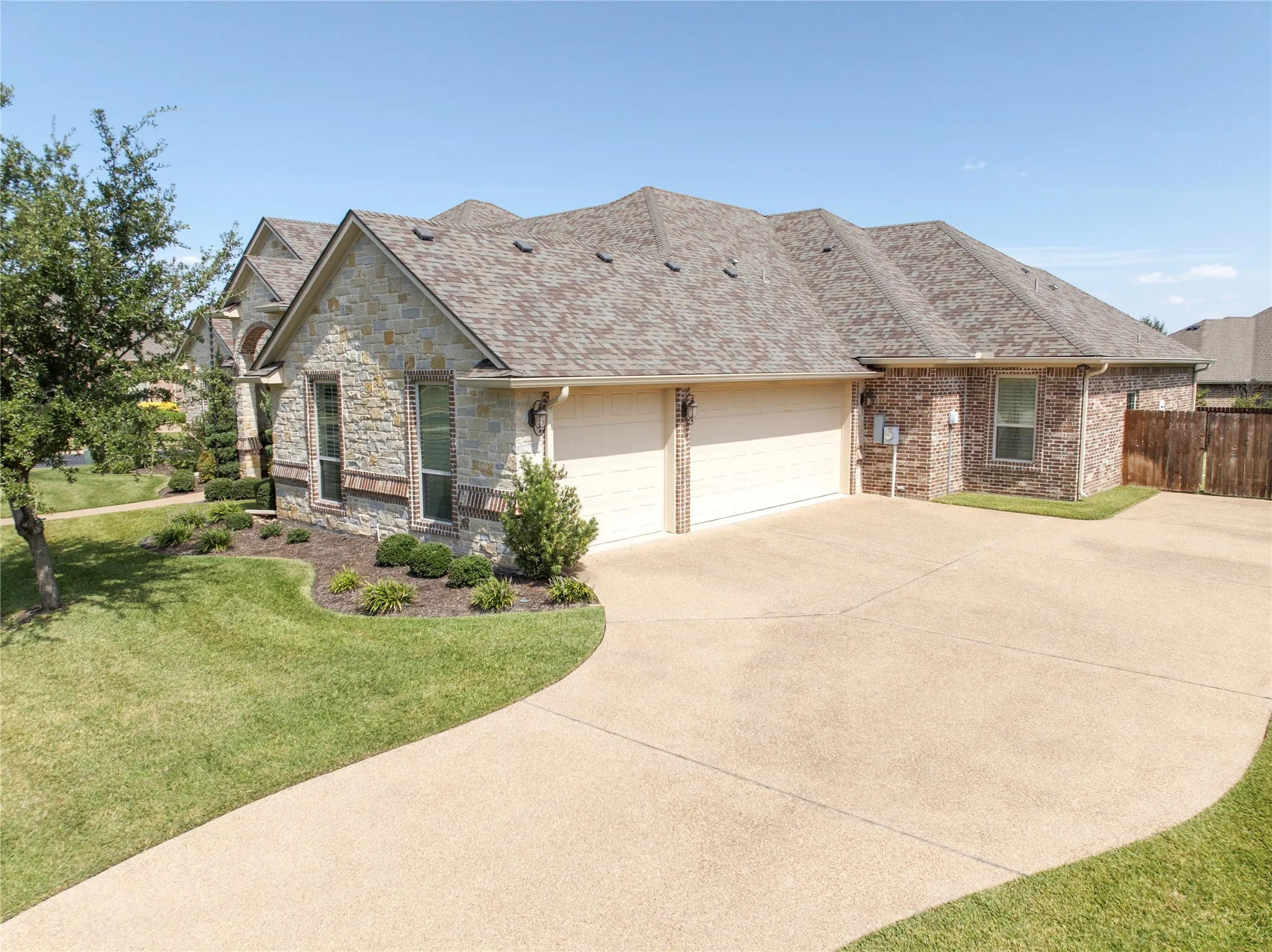 Stone and brick facade with a two-car garage