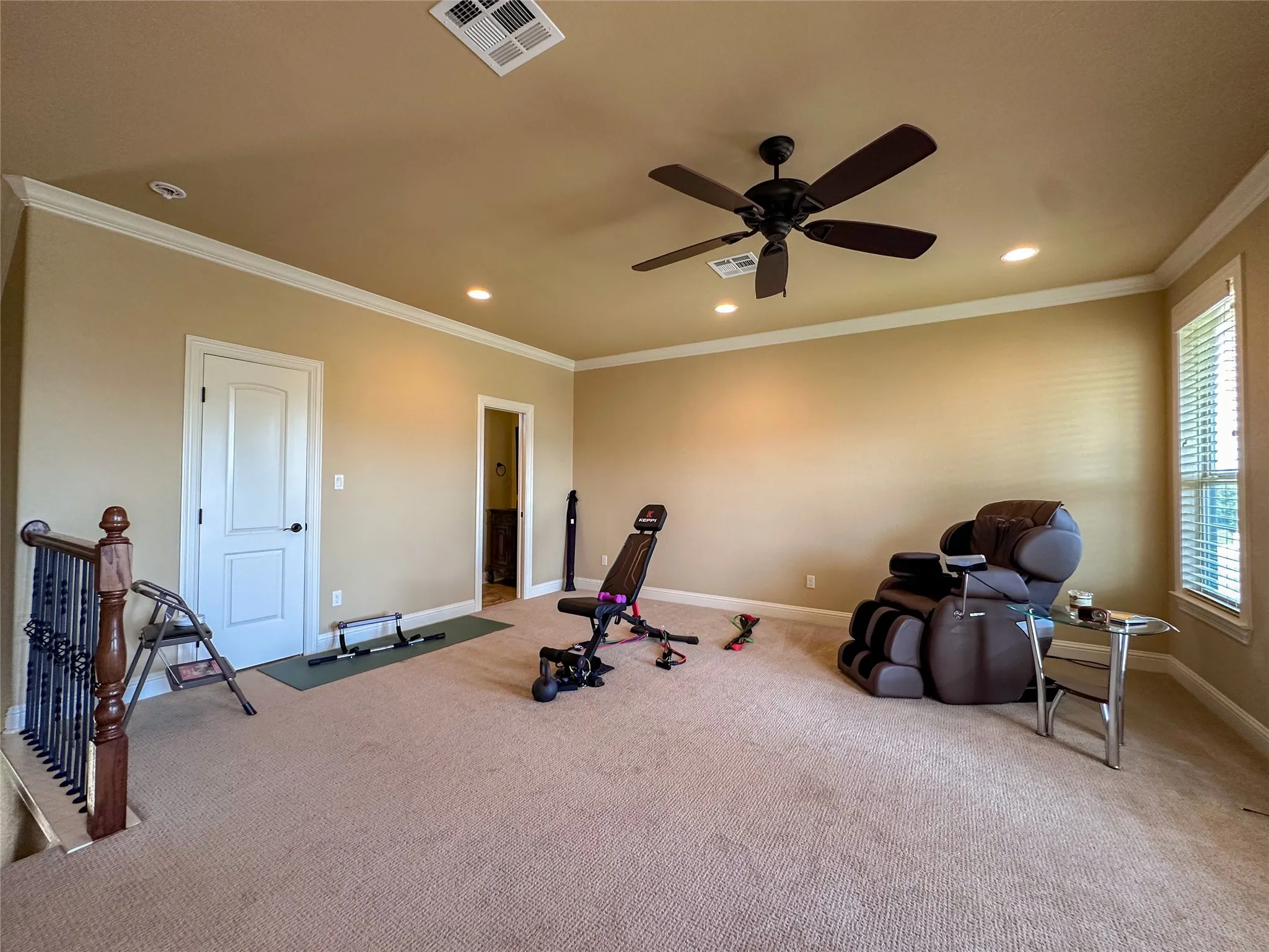 Carpeted room featuring a ceiling fan, recessed lighting, crown molding, and window​​‌​​​​‌​​‌‌​‌‌​​​‌‌​‌​‌​‌​​​‌​​ blinds