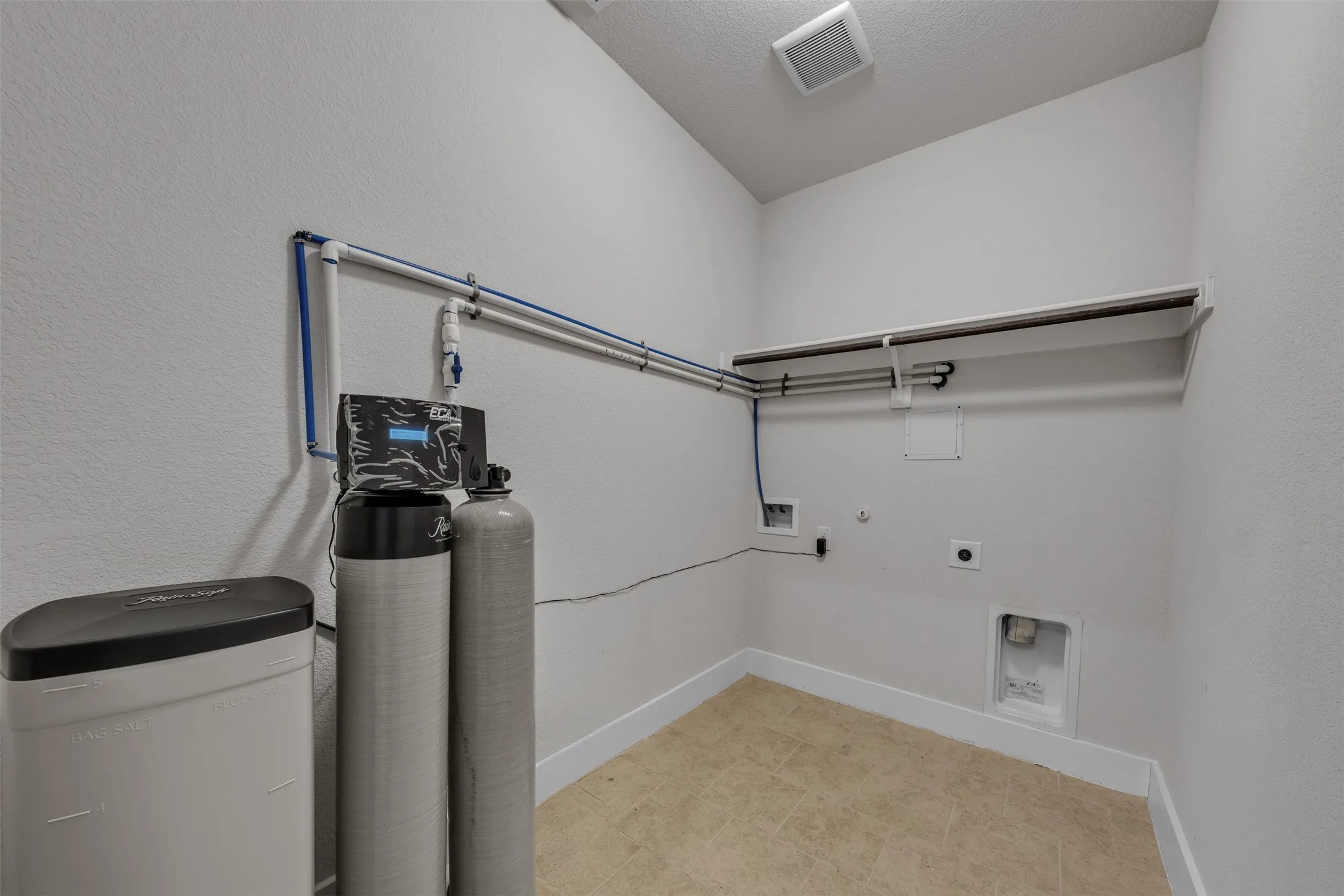 Dedicated Laundry Room + Home Water Softener System at 5149 Cantle Ct in Fort Worth, Texas, Tarrant County, with no pass through and room for side by side washer and dryer.