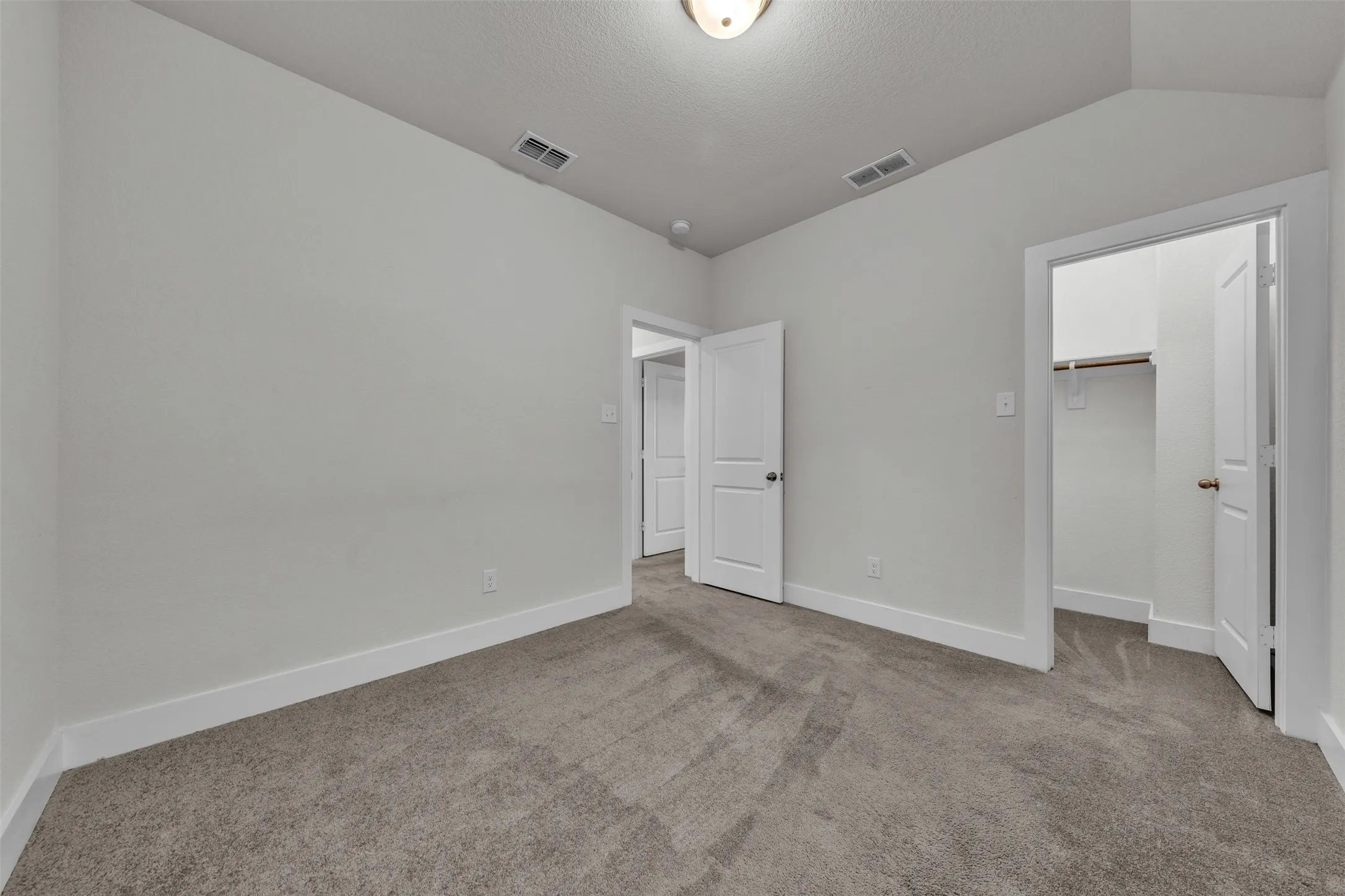 Bedroom 4 at 5149 Cantle Ct in Fort Worth, Texas, Tarrant County, with light colored carpet facing large windows allowing natural light. Located on second floor.