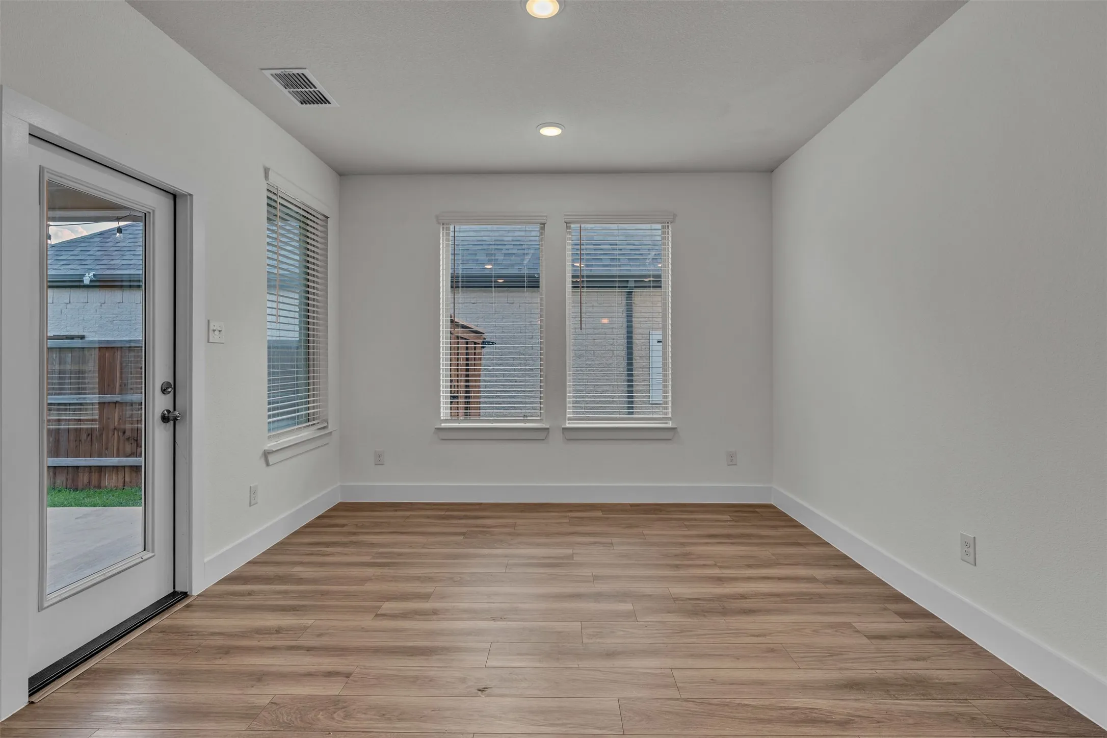 Dining area at 5149 Cantle Ct in Fort Worth, Texas, Tarrant County, with lots of windows and natural light and plenty of room for a large dining table for gatherings.